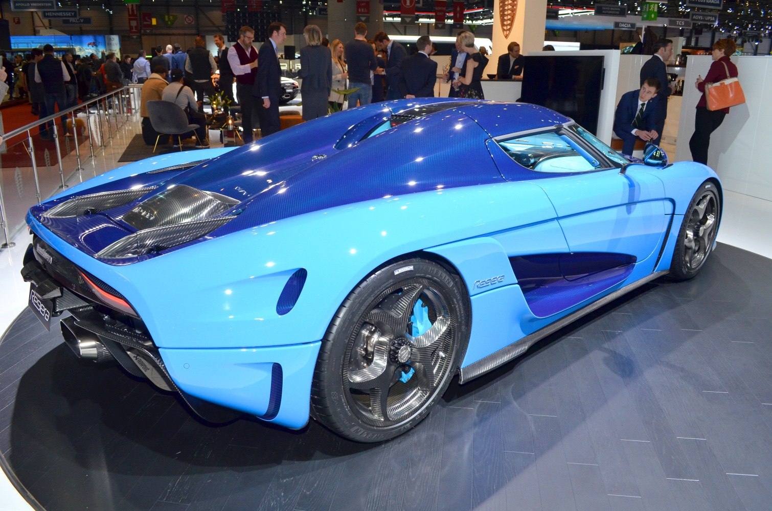 Rear-side view of hypercar with carbon fiber details and racing wheels