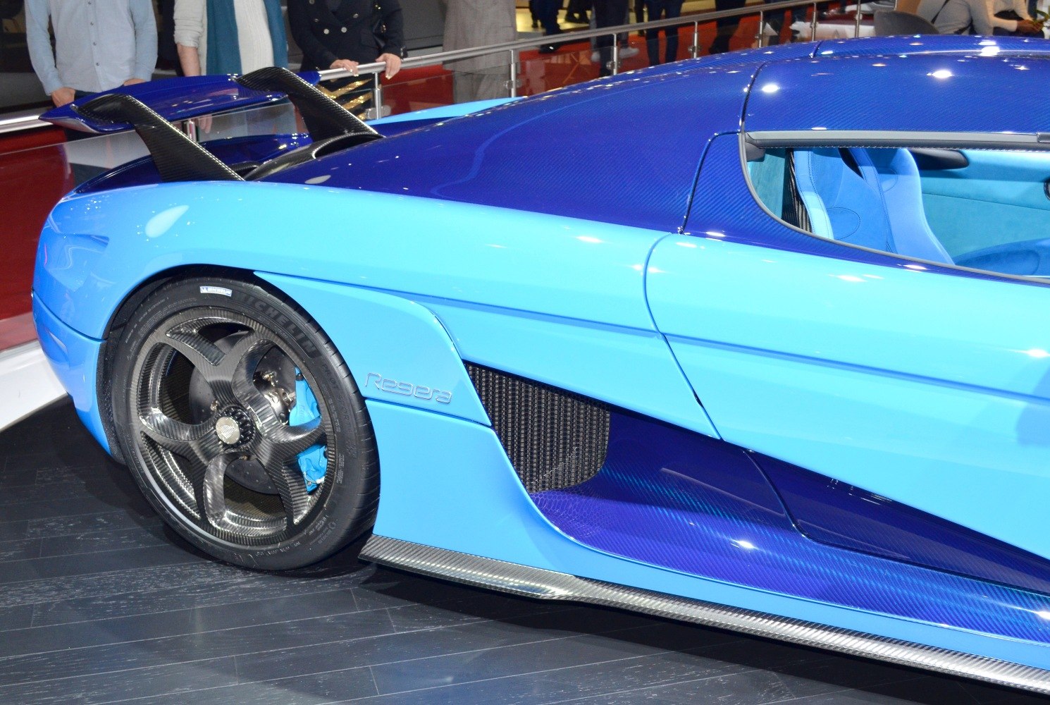 Rear side with carbon fiber wheel and dual spoiler