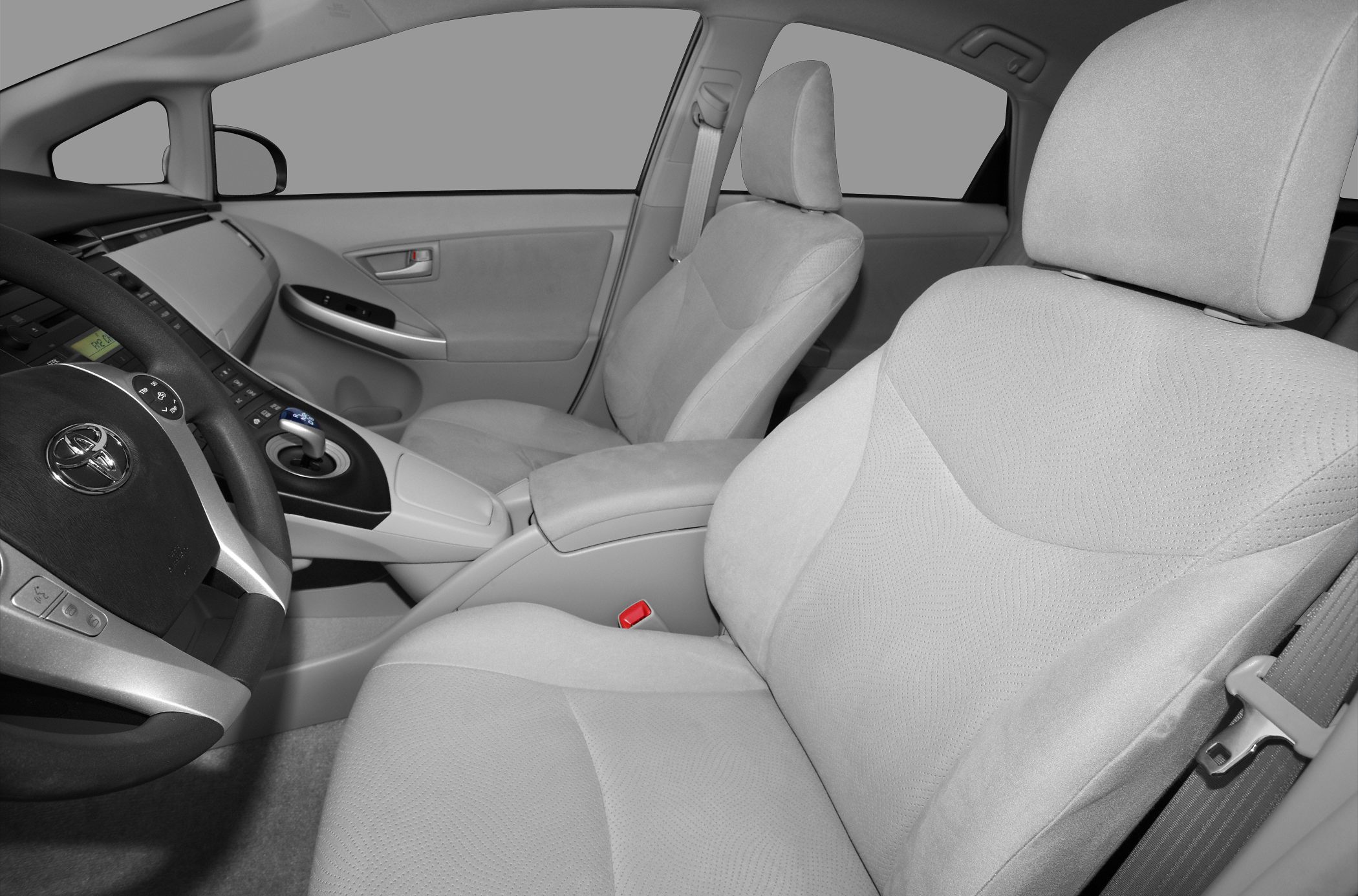Spacious front seats and dashboard with gear selector.