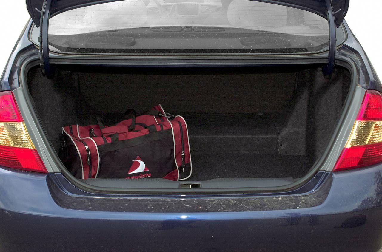 Open rear trunk with sports bag in first-generation hatchback