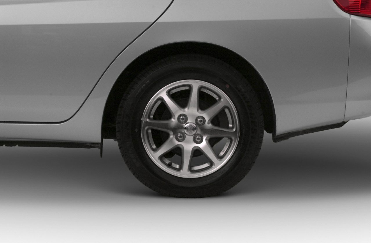 Close-up of a rear alloy wheel with multi-spoke design and tire.
