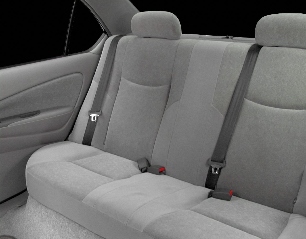 Rear seat interior with fabric upholstery and seatbelts