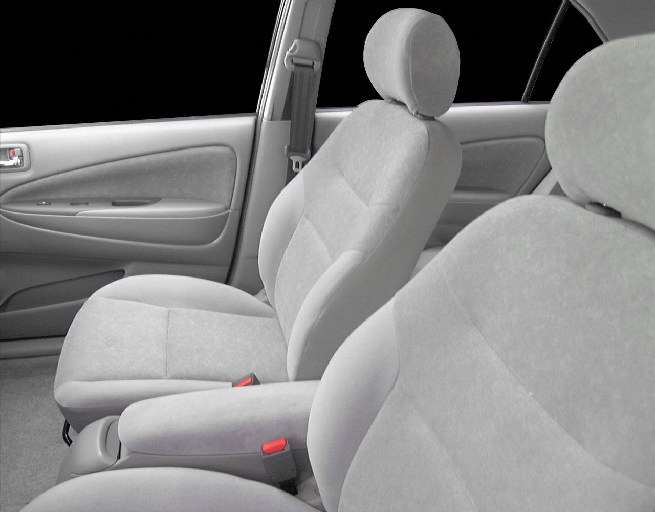 Front interior seats and door panel with fabric upholstery and armrest