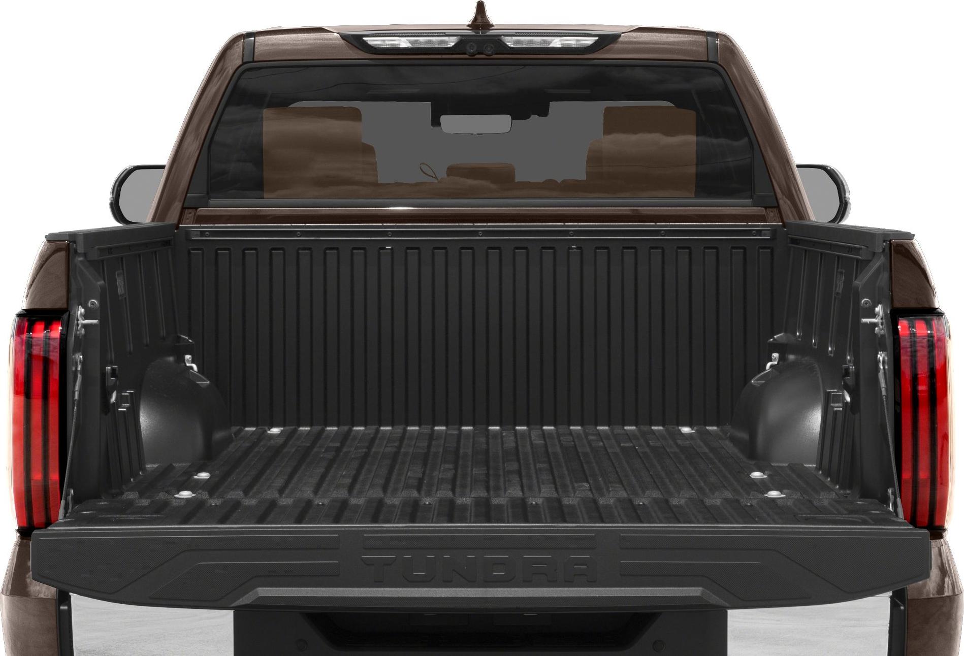 Open rear bed with protective liner and tailgate of a pickup truck