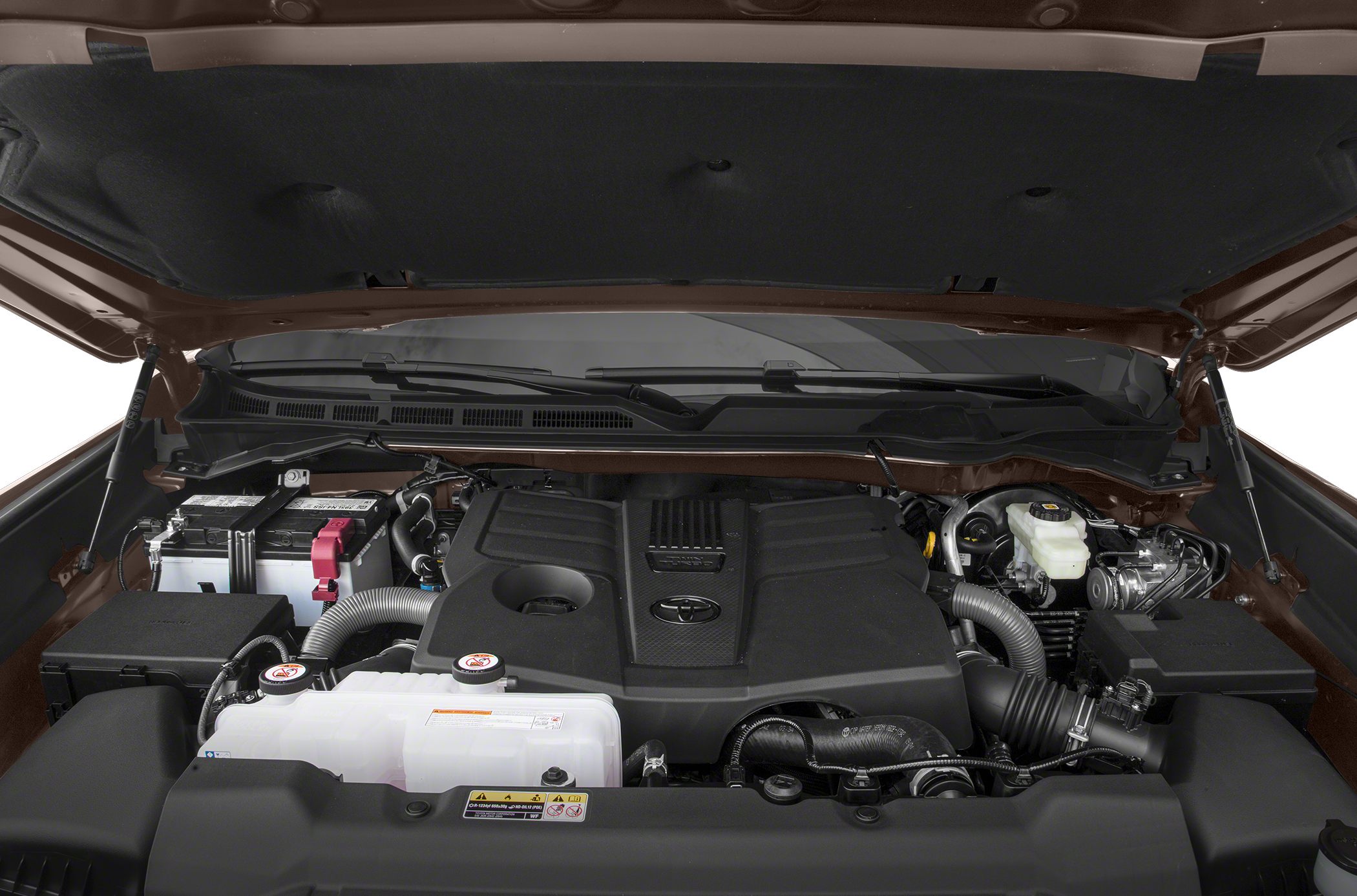 Close-up of engine bay with engine cover and mechanical components