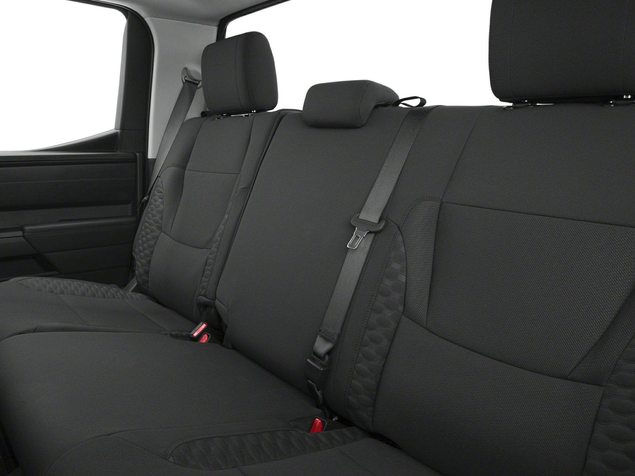 Rear seat cabin interior with black upholstery and safety belts.