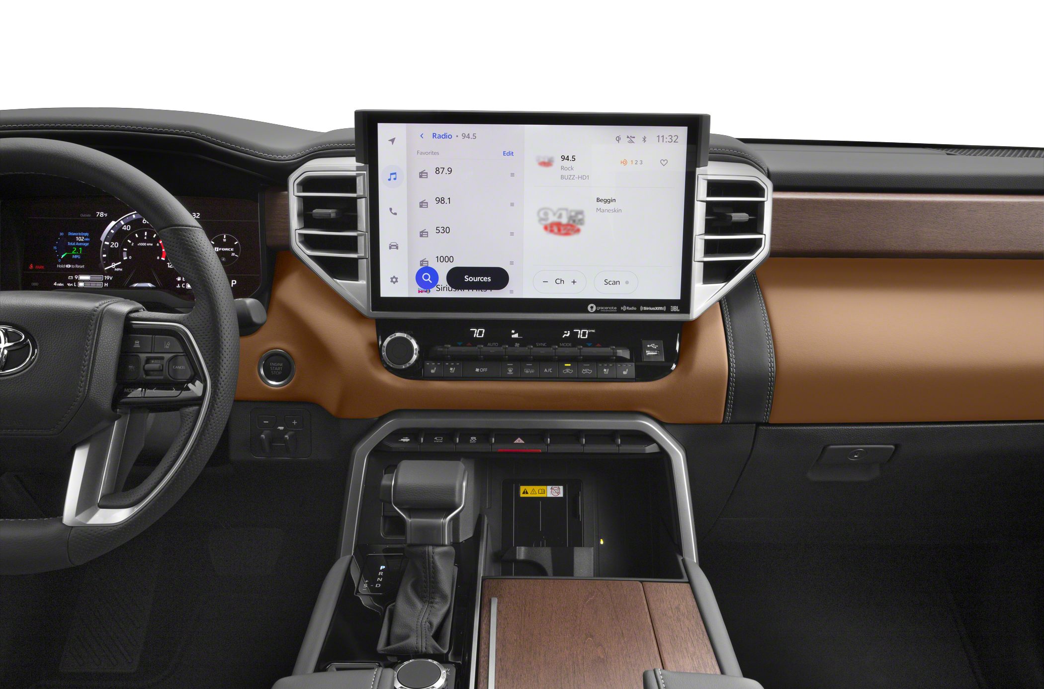 Large touchscreen infotainment and digital instrument cluster with premium control layout