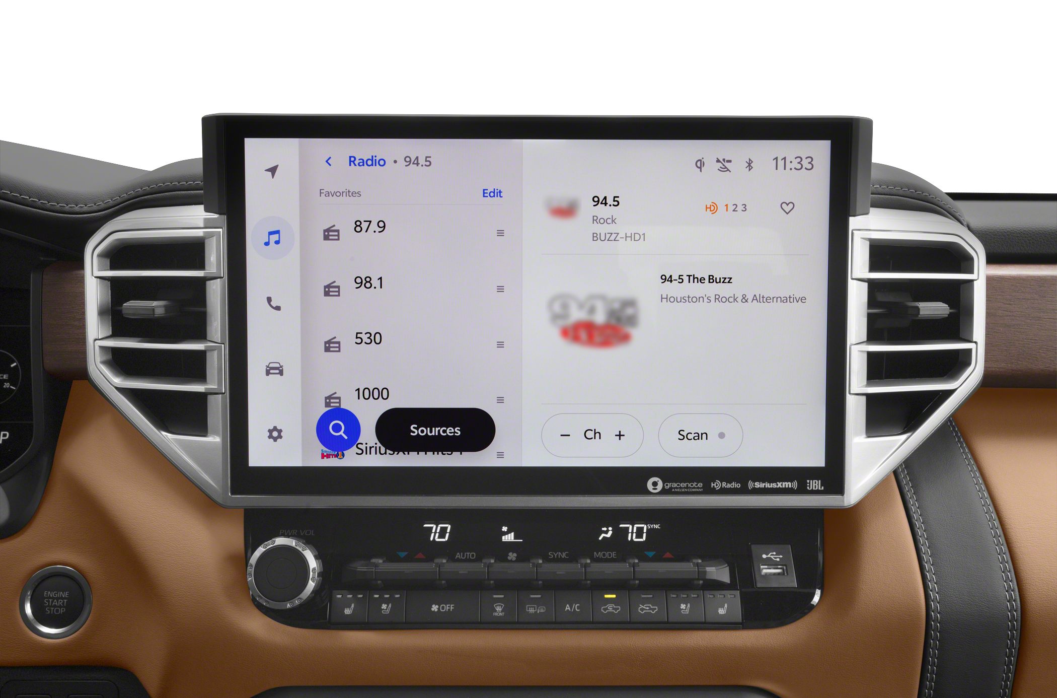 Large touchscreen radio display and dual-zone climate controls in dashboard