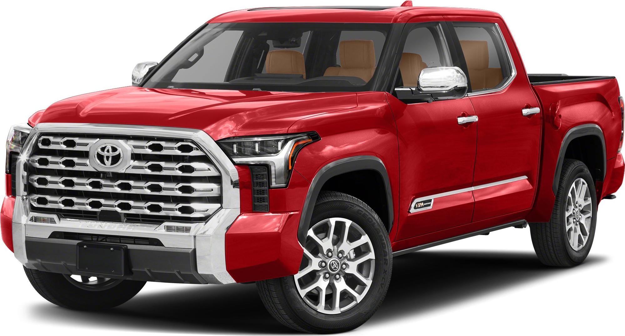 Red pickup truck front and side view with chrome grille and alloy wheels