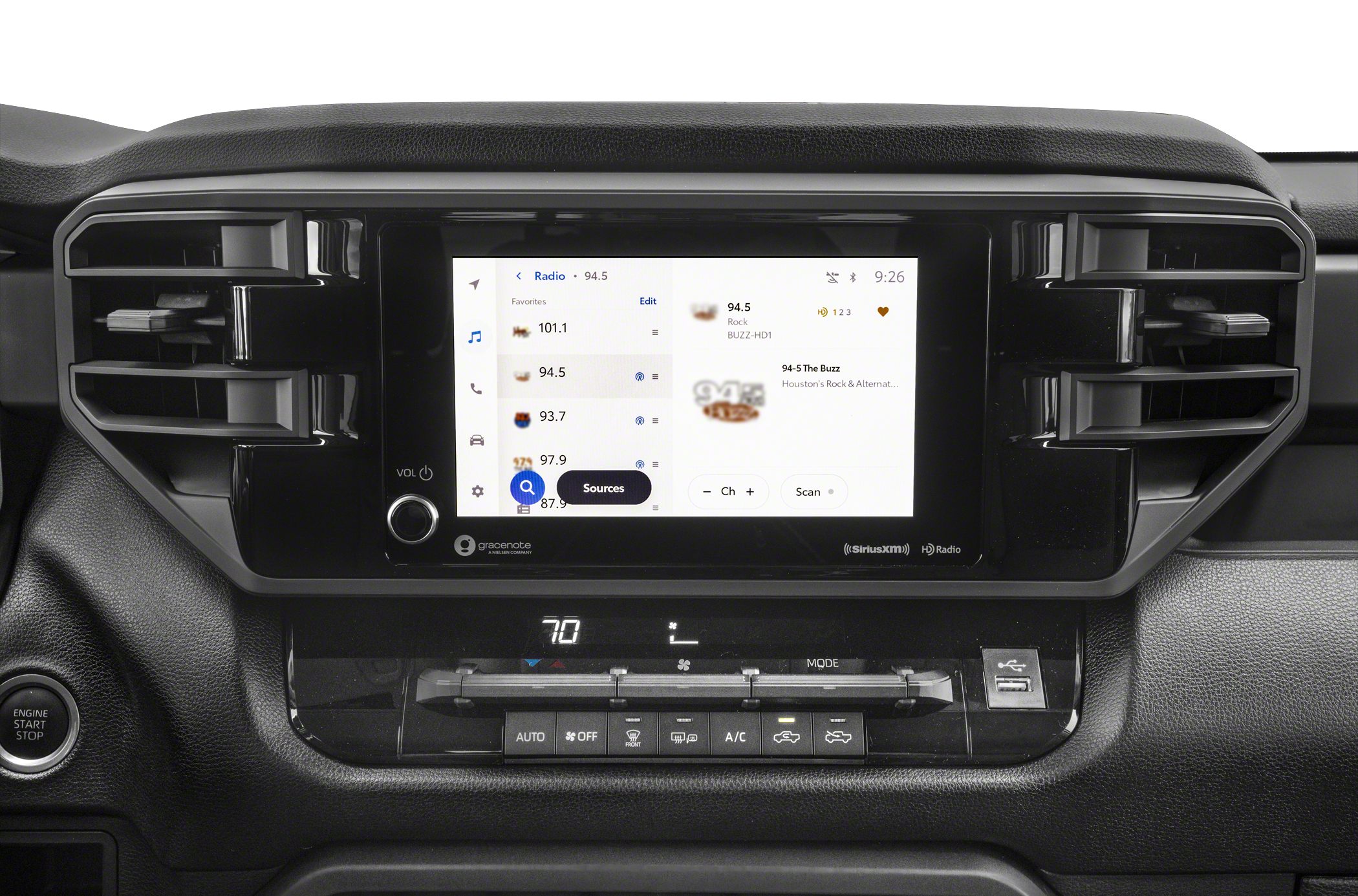 Central touchscreen infotainment and climate control panel with dual air vents