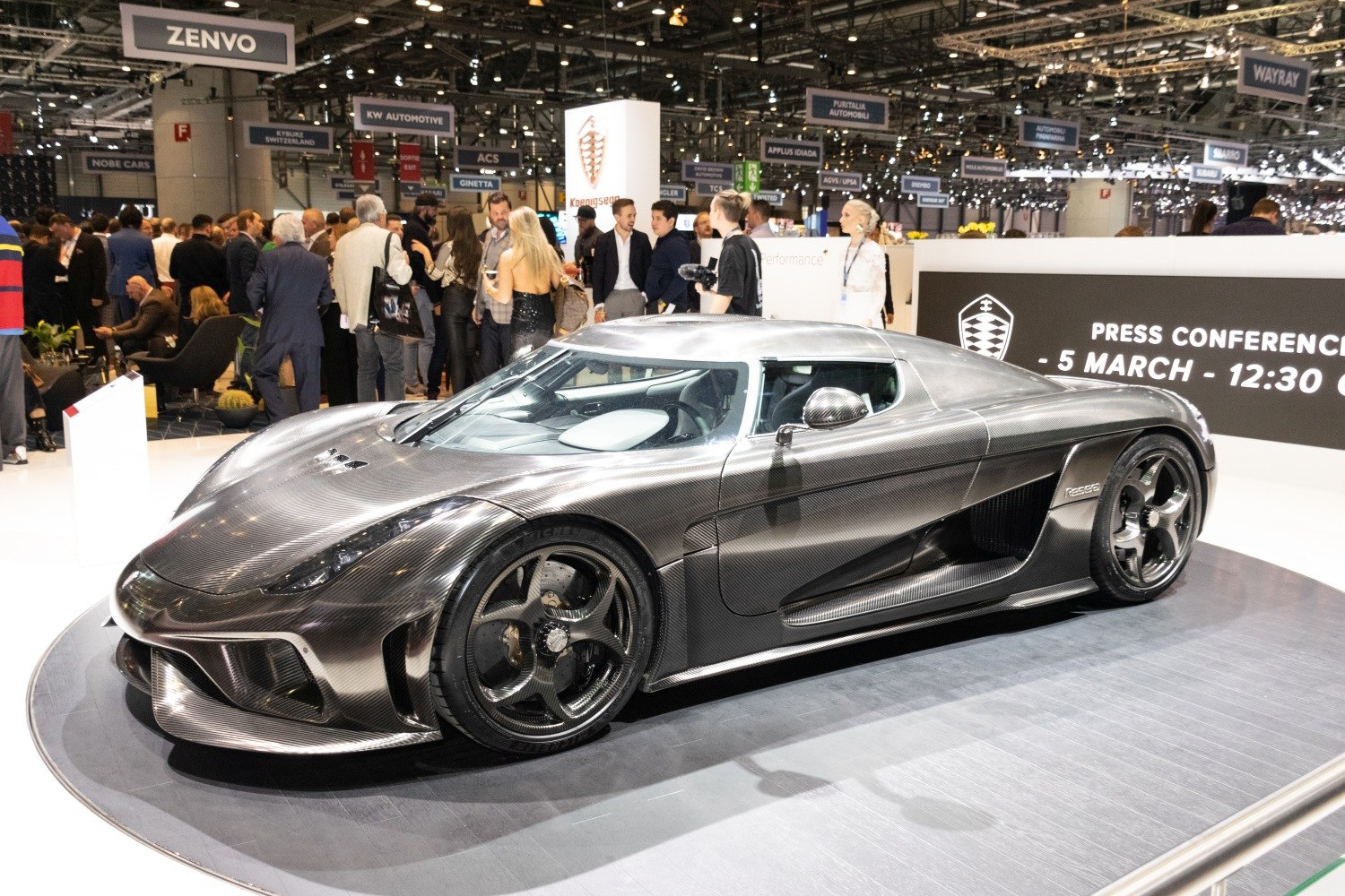 Carbon fiber body hypercar with aerodynamic design and sporty wheels
