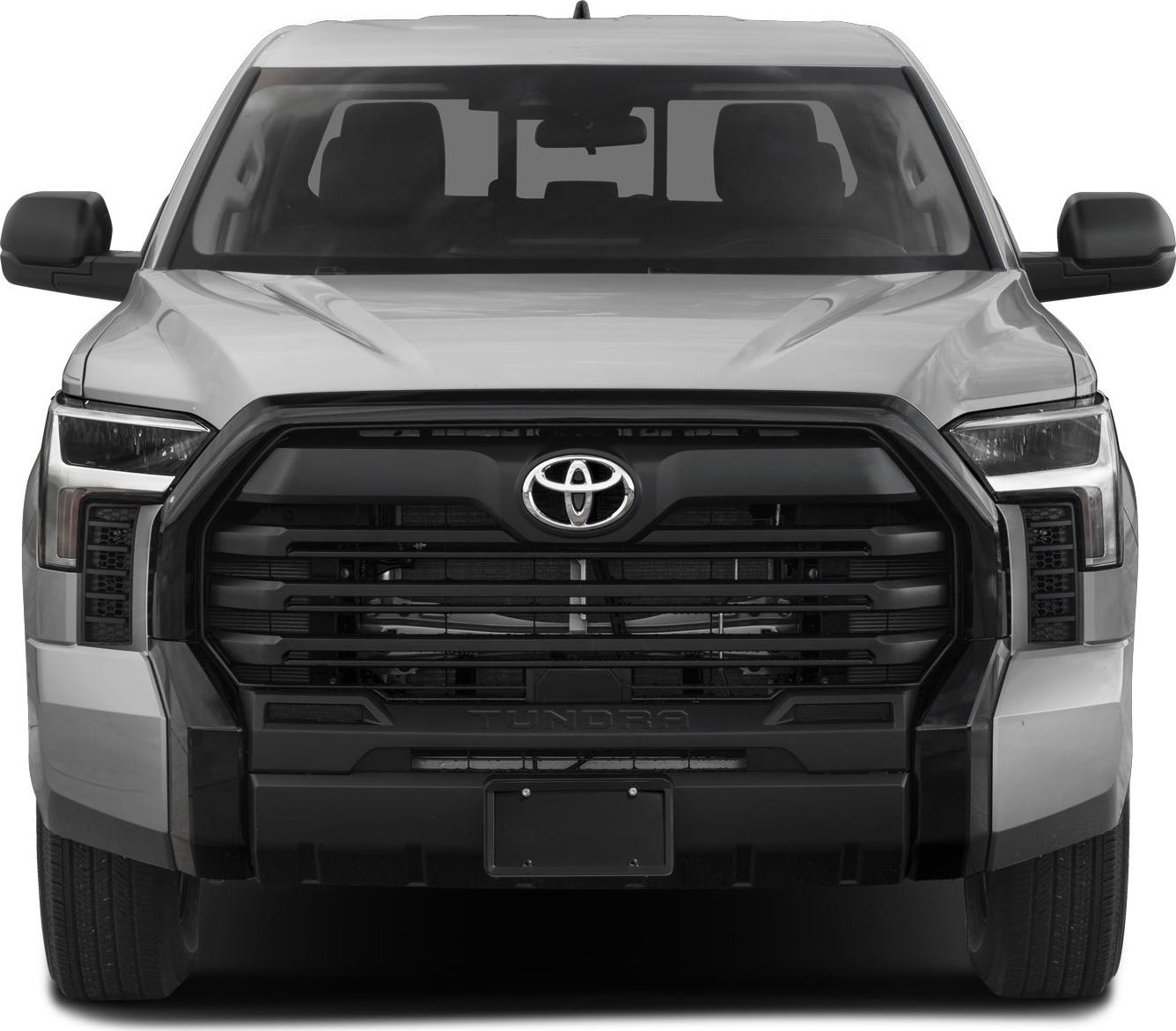 Close-up front view of large aggressive grille and headlights