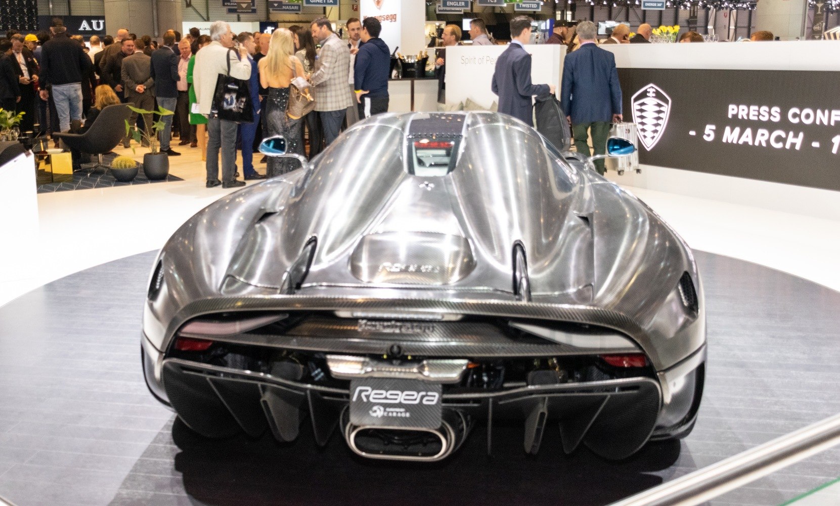 Rear view with exposed carbon fiber body and central exhaust