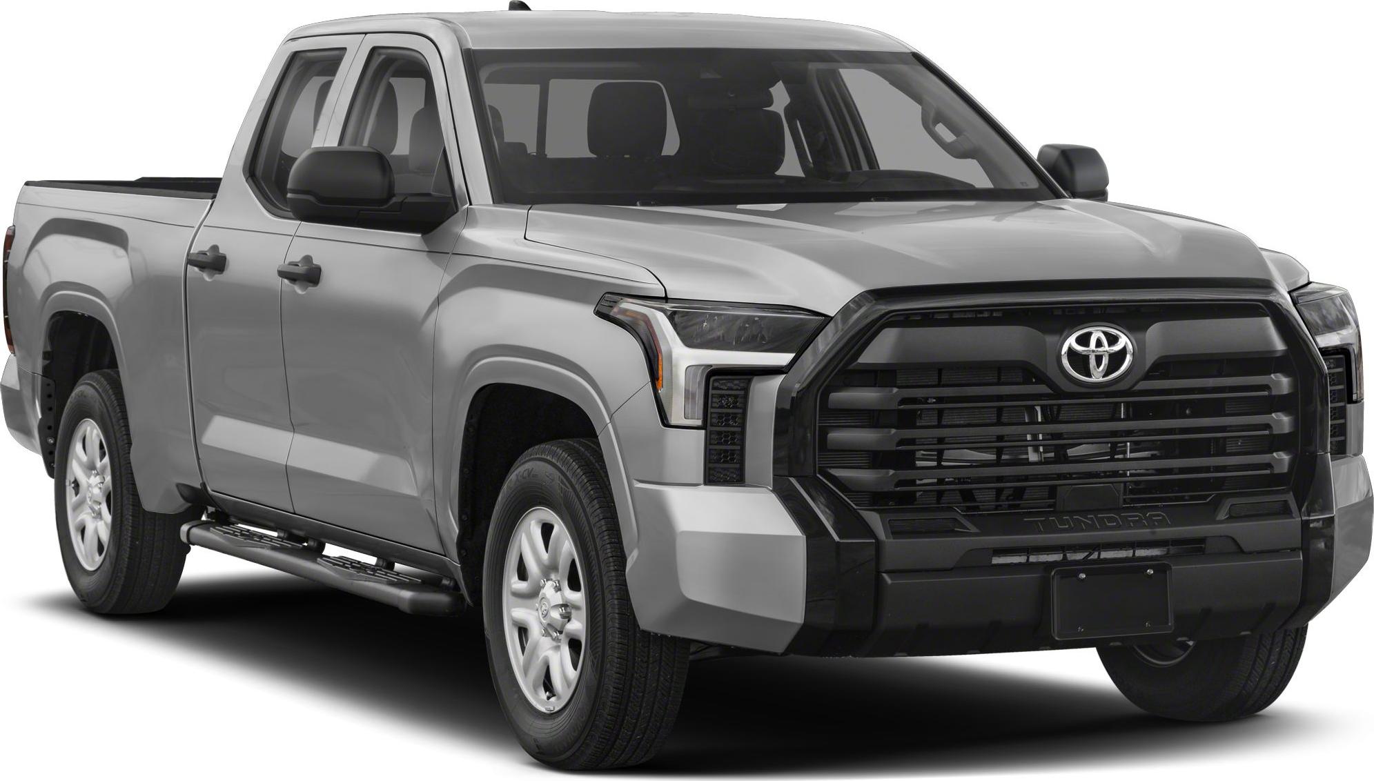 Front view of pickup with bold black grille and side steps