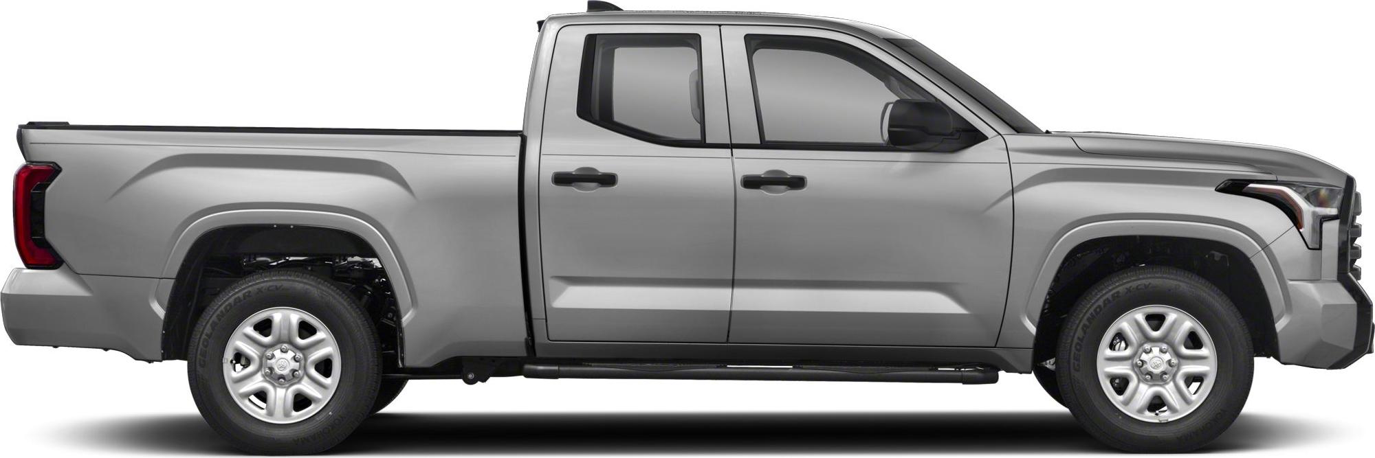 Silver double cab pickup truck with standard bed side view