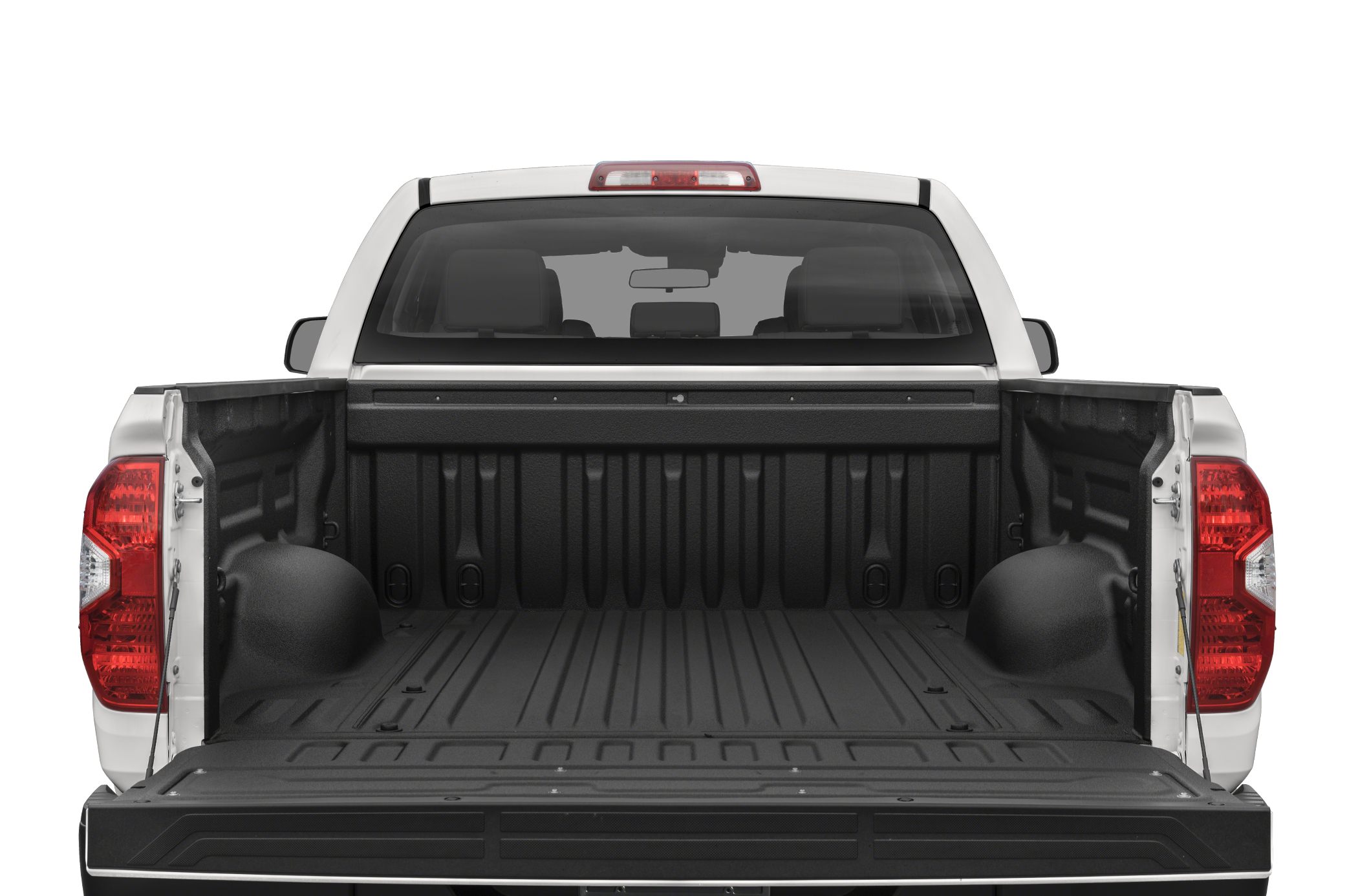 Open pickup truck bed and lowered tailgate with protective liner