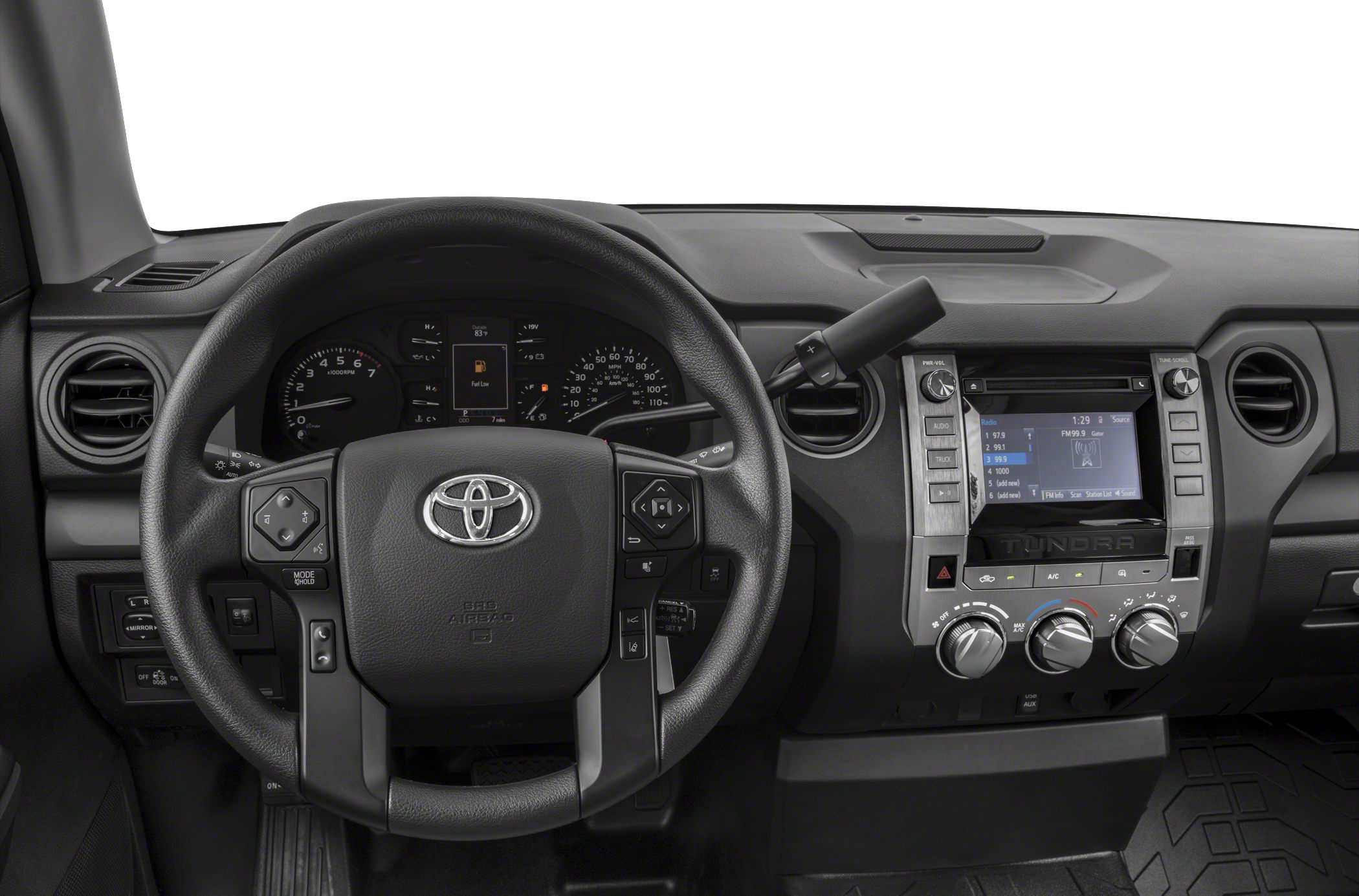 Steering wheel and dashboard with infotainment system and climate controls.