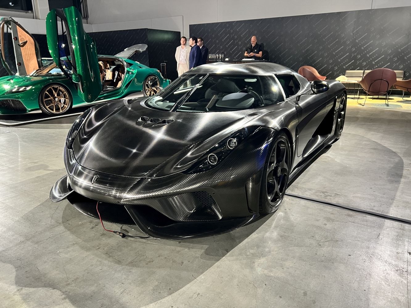 Exposed carbon fiber hypercar with aerodynamic curves and advanced headlights