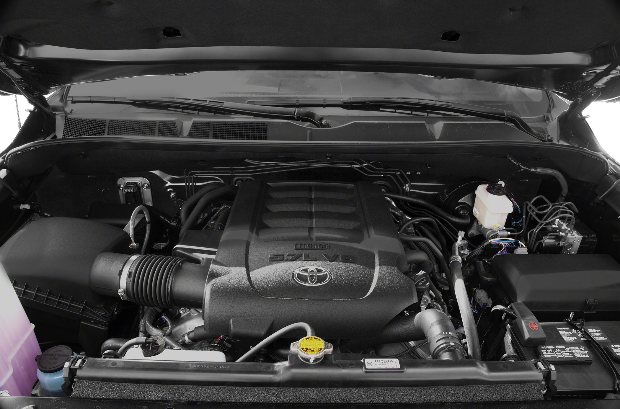 Under hood view of 5.7L V8 engine with intake and radiator cap visible
