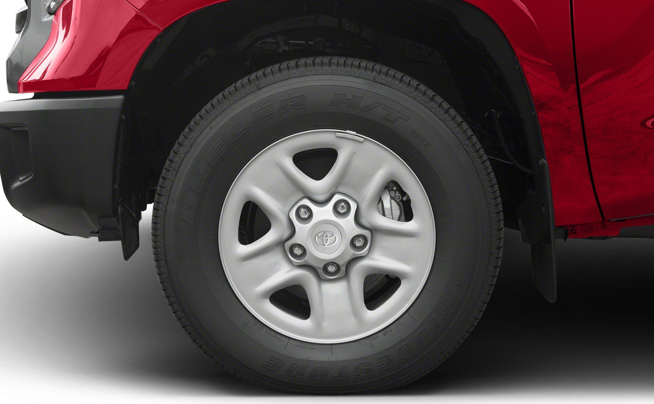 Close-up of alloy wheel and Bridgestone Dueler H/T tire on pickup.