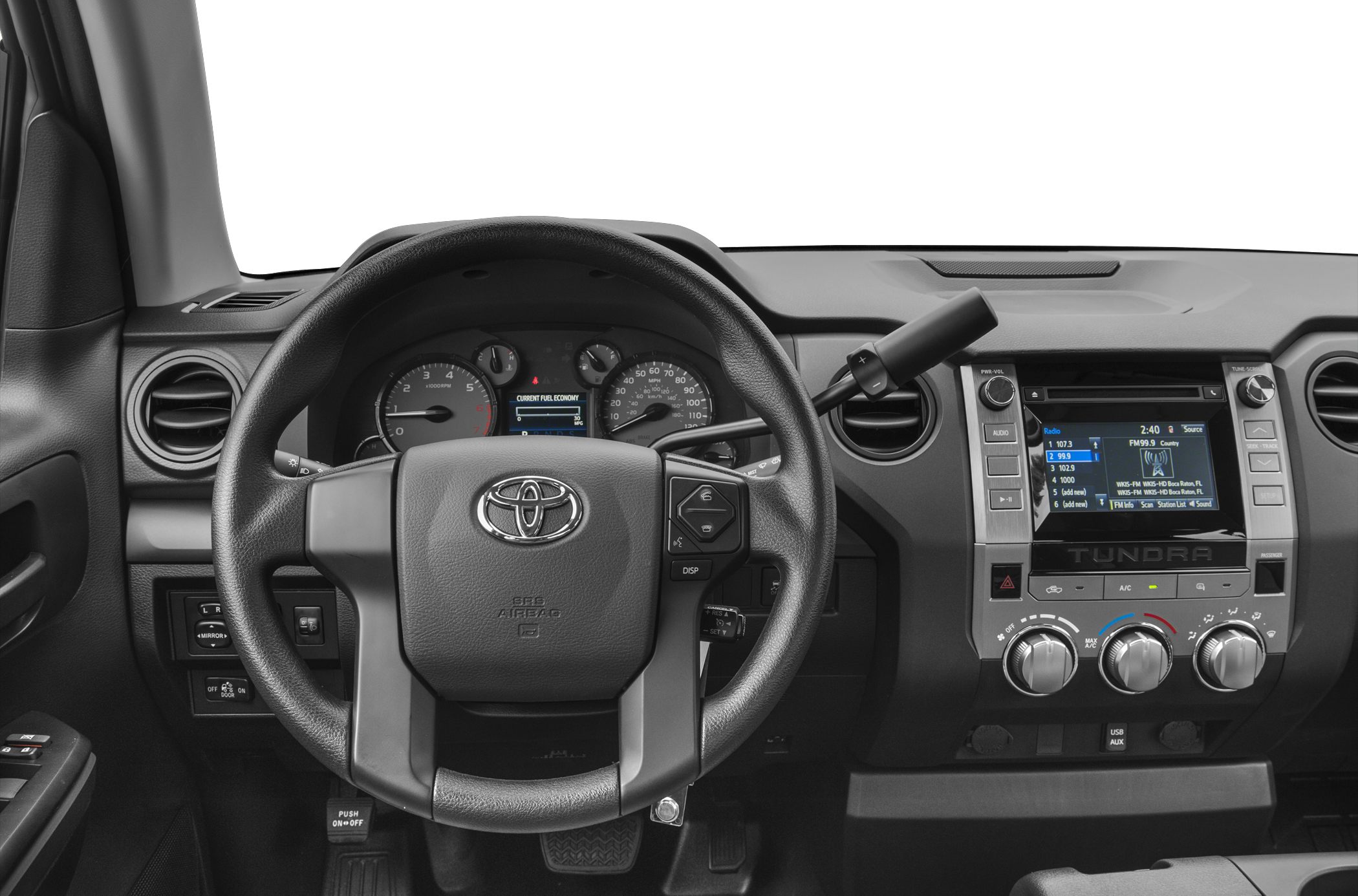 Steering wheel, instrument cluster, and dashboard controls inside a vehicle