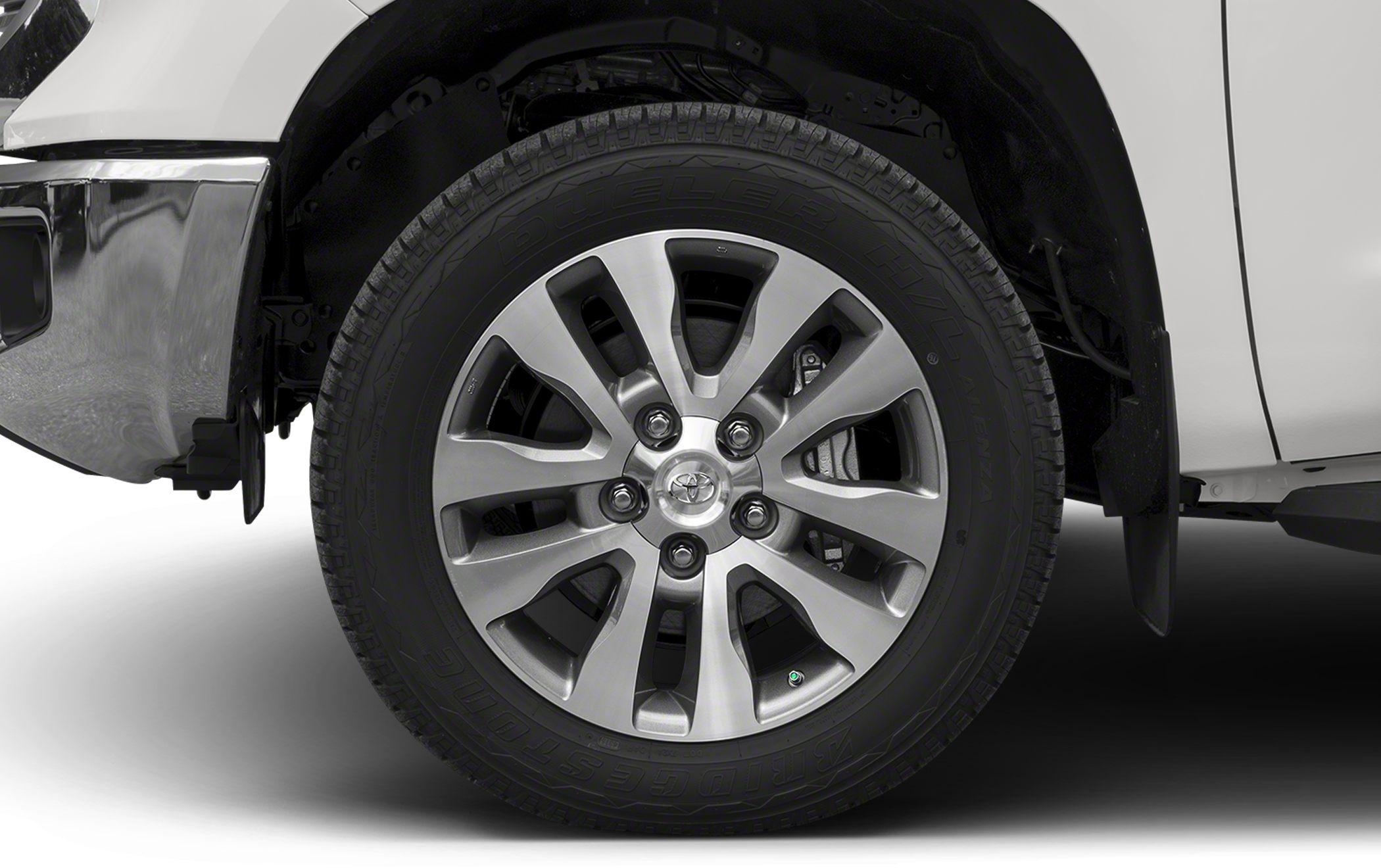 Alloy wheel with Bridgestone Dueler tire on truck front left side