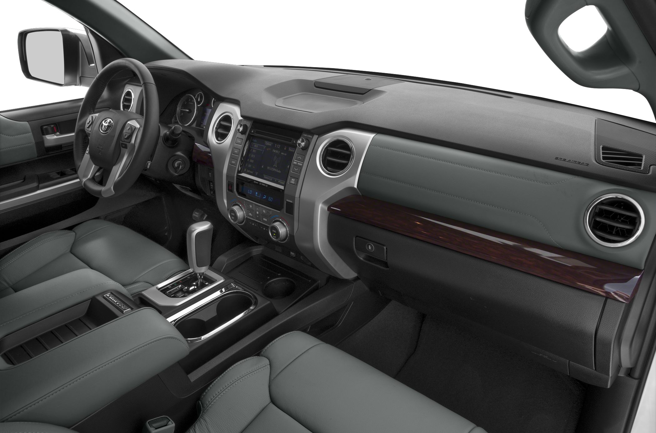 Dashboard with steering wheel, infotainment, gear shifter, and air vents.