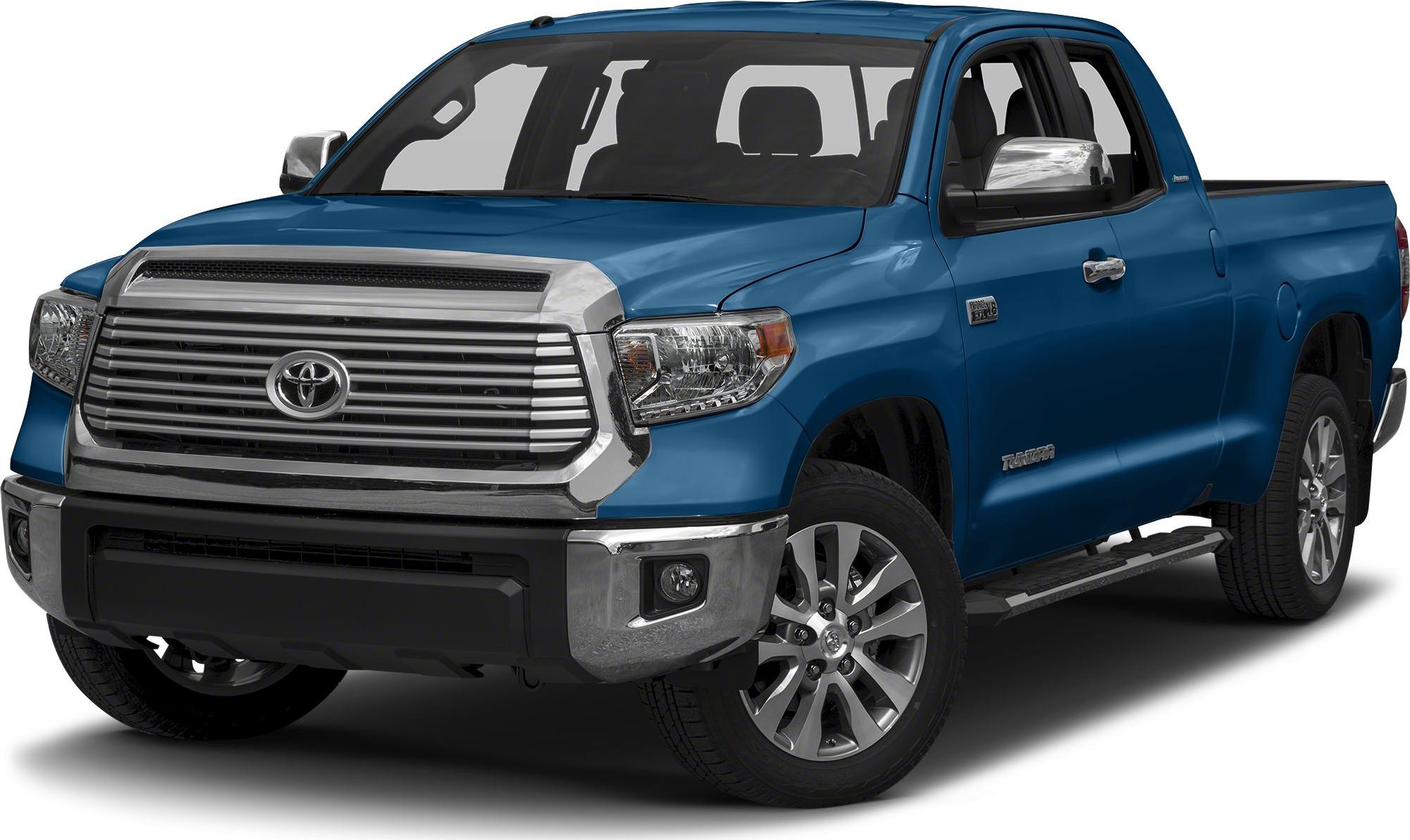 Blue double cab pickup with large chrome grille and alloy wheels
