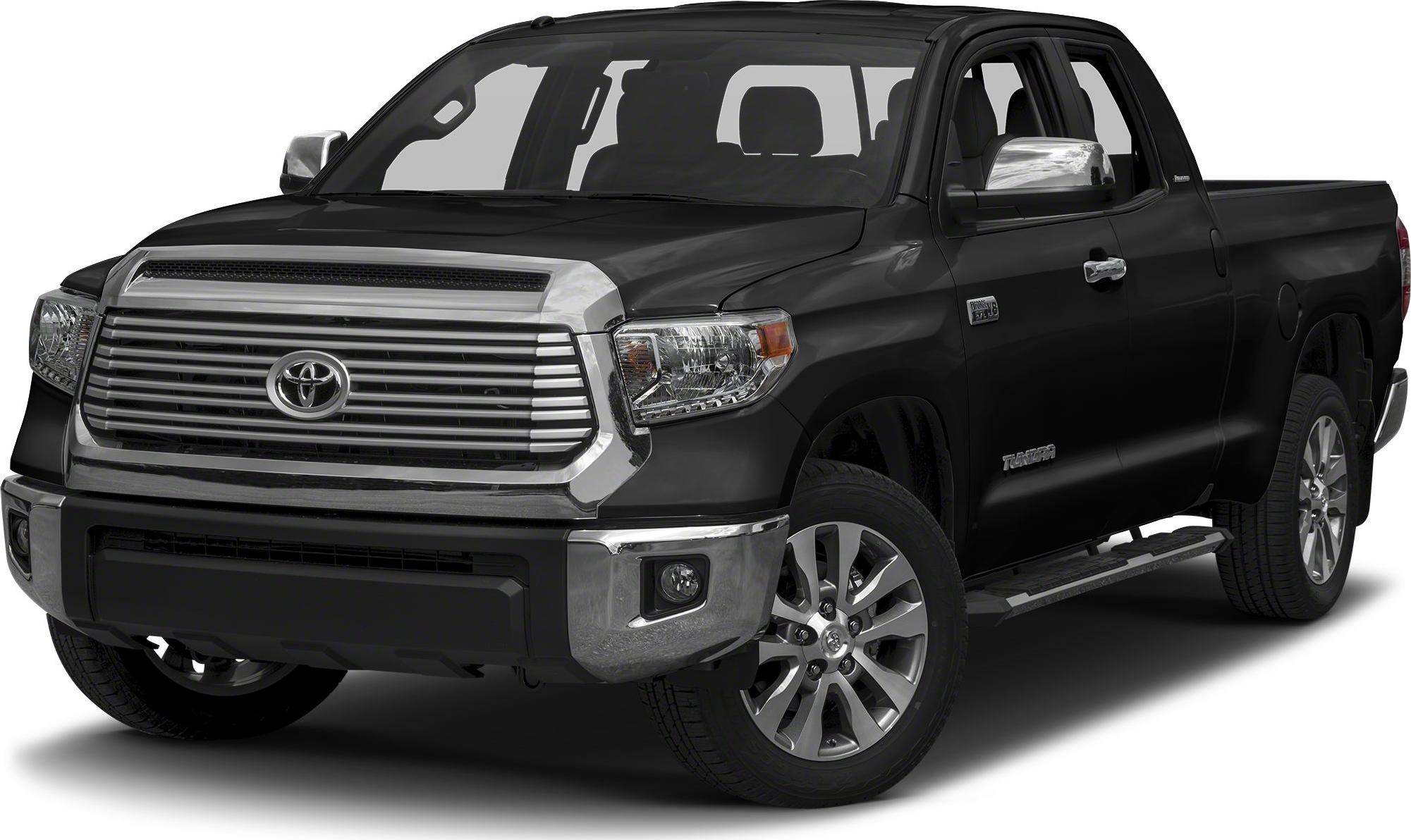 Front view with prominent grill, headlights, and side mirror