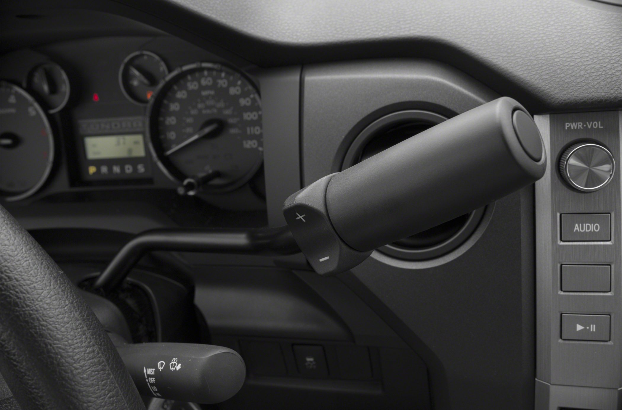 Shift lever, dashboard controls, speedometer and steering column close-up