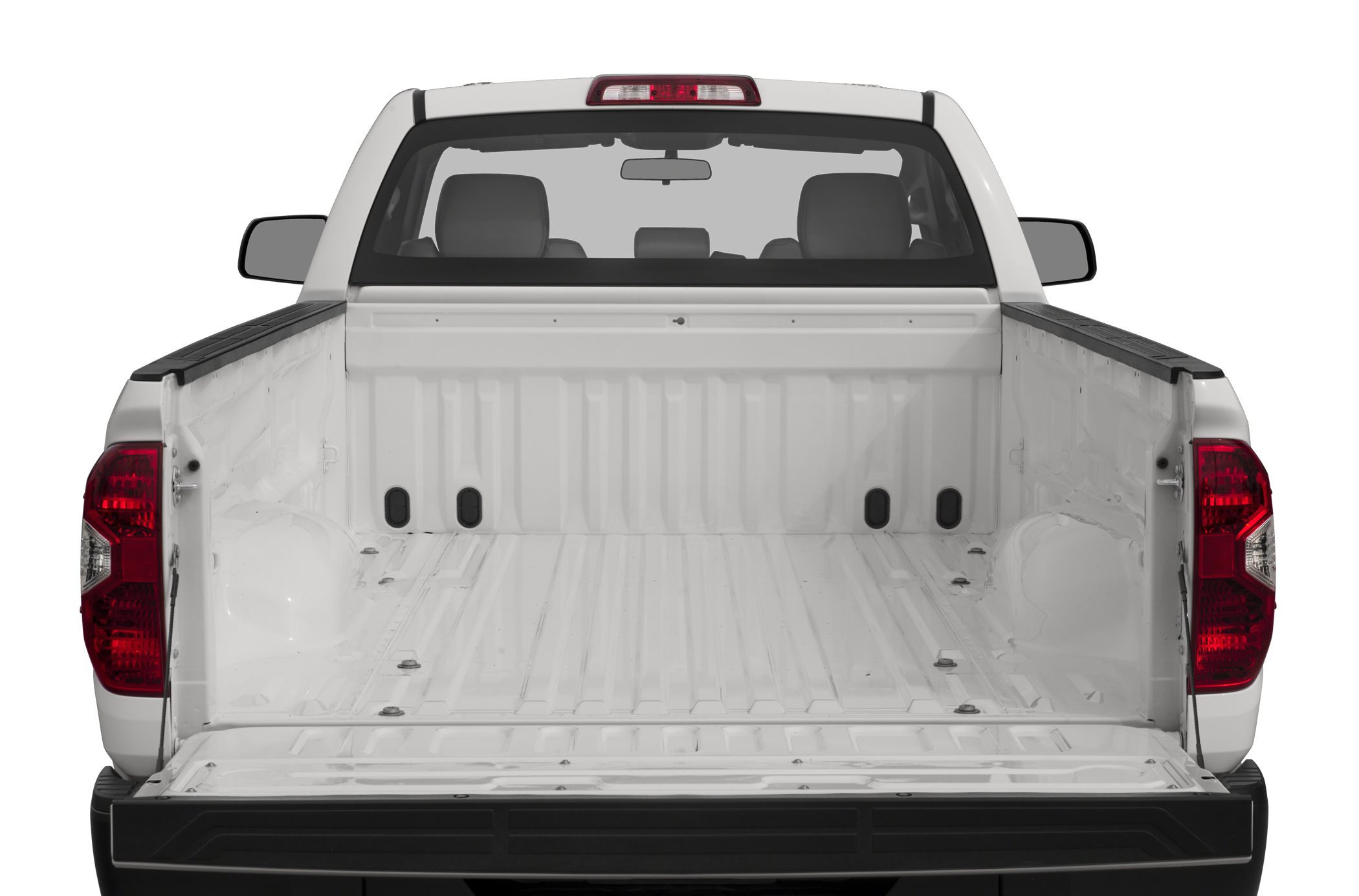 Spacious open pickup truck bed with tailgate and rear window.