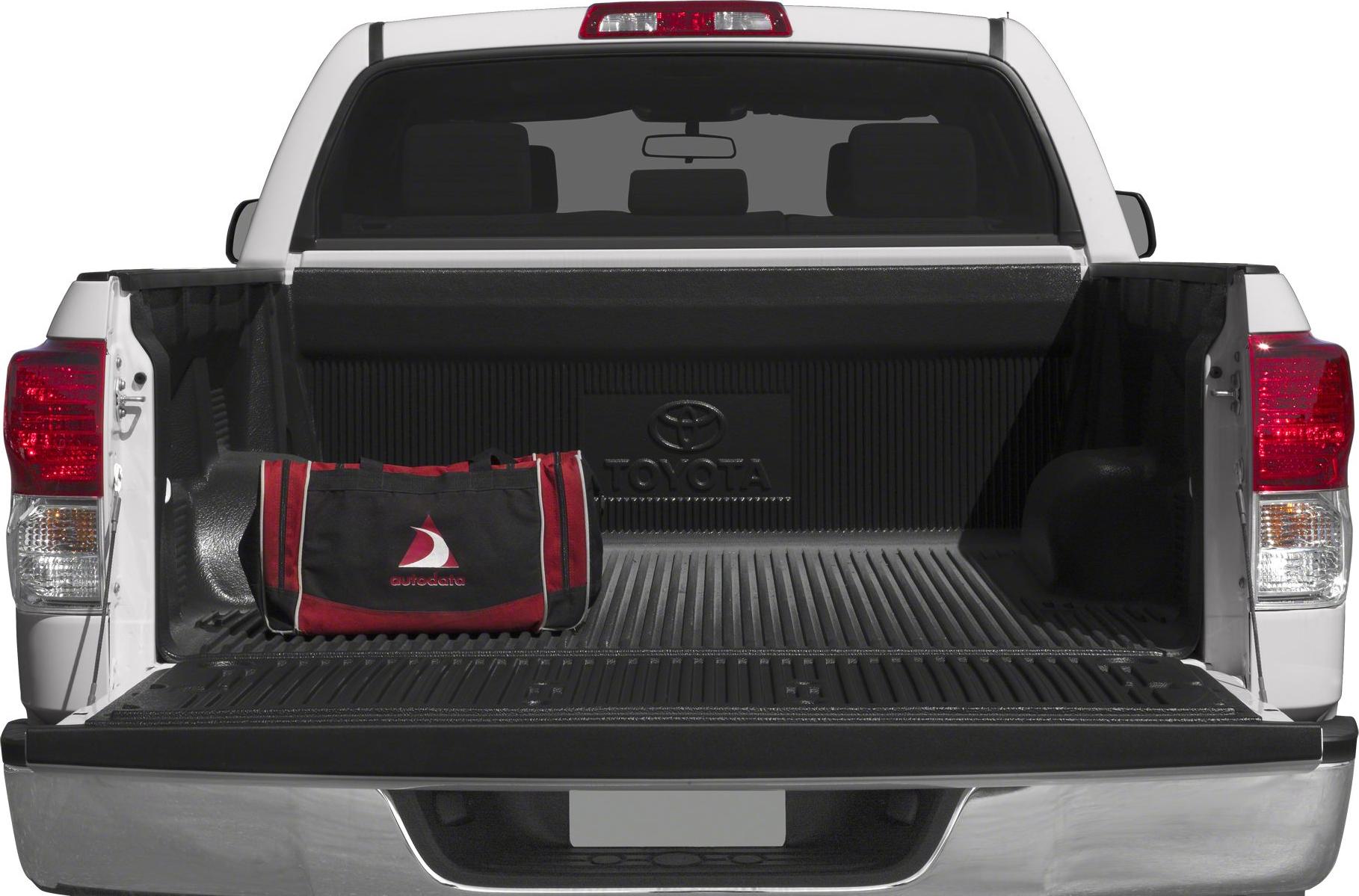 Open pickup truck cargo bed with bed liner and black-red bag