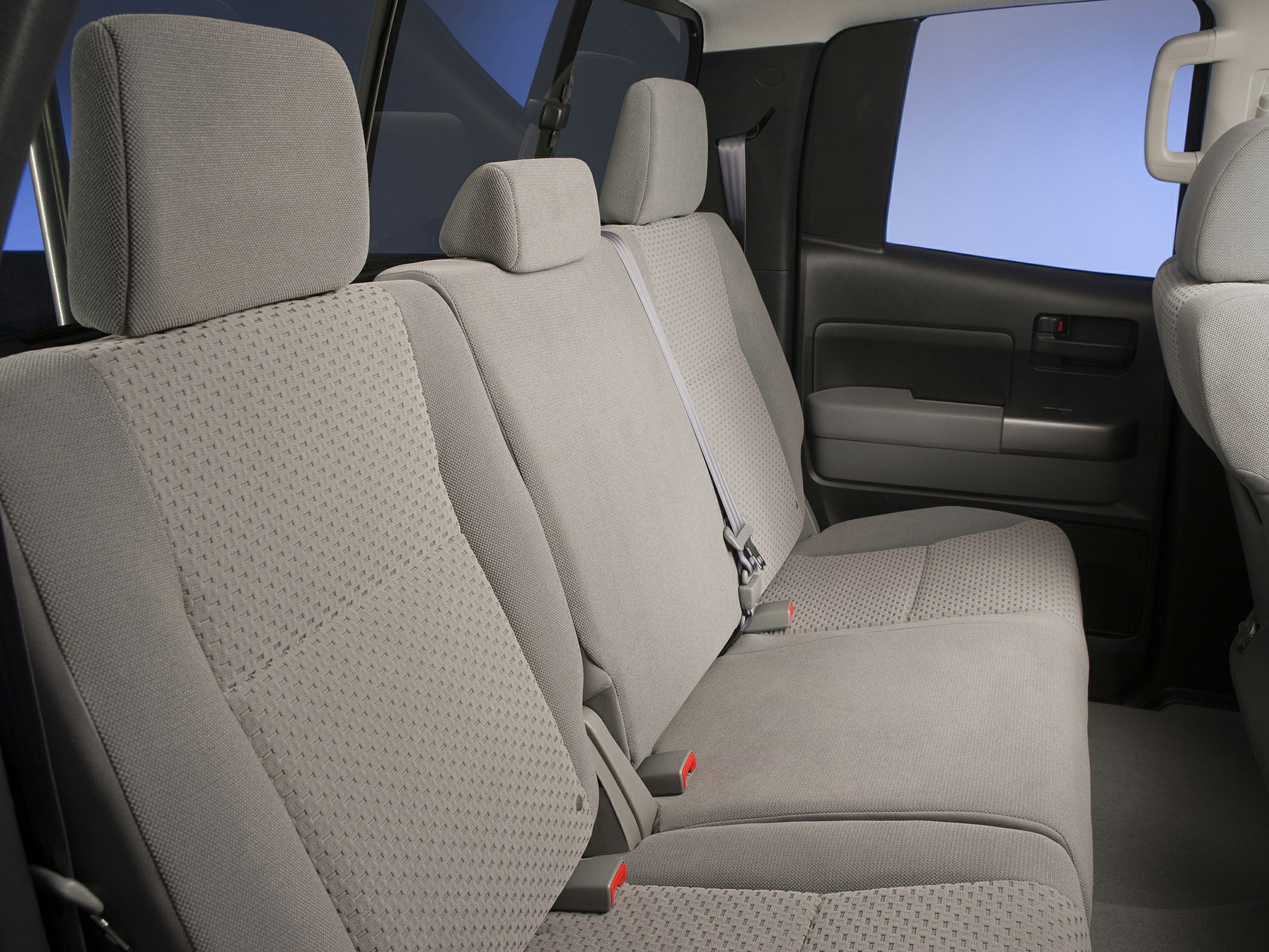 Rear fabric seats with headrests and seat belts in a double cab pickup interior