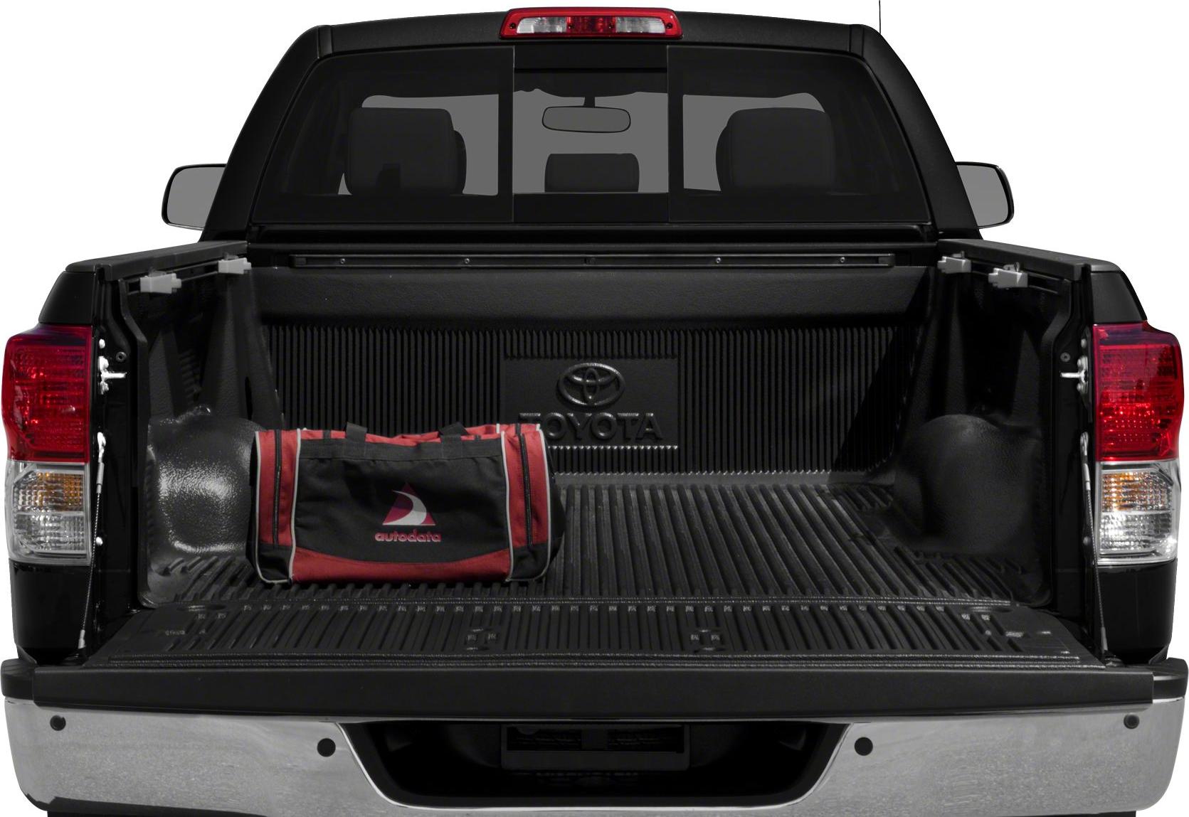 Open pickup truck bed with protective liner and a bag placed inside