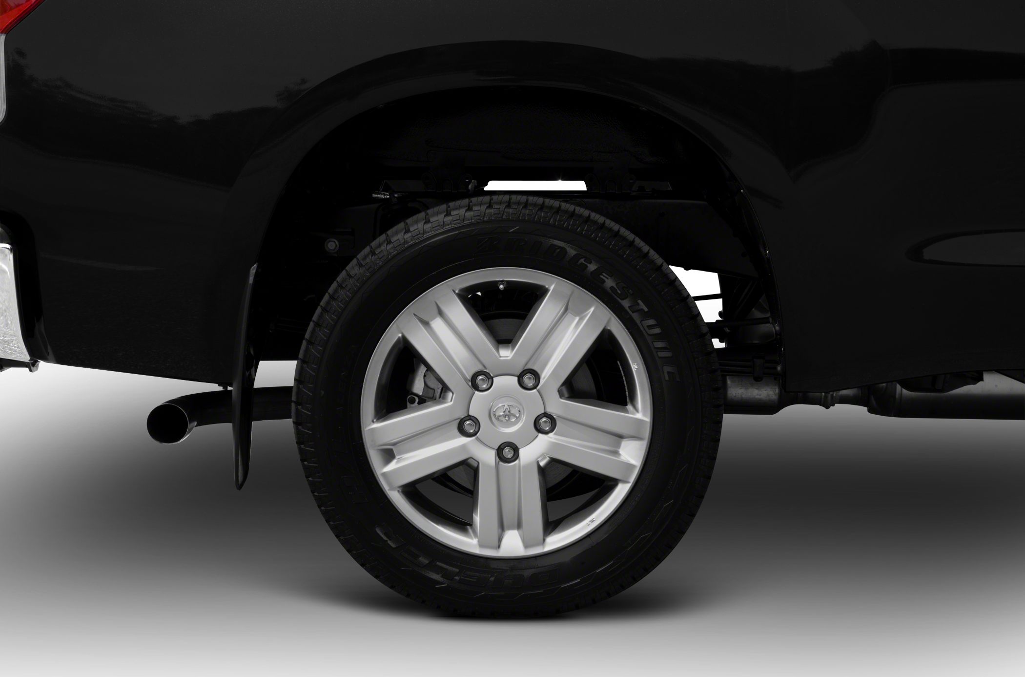 Close-up of a rear wheel with 5-spoke alloy rim and Bridgestone tire