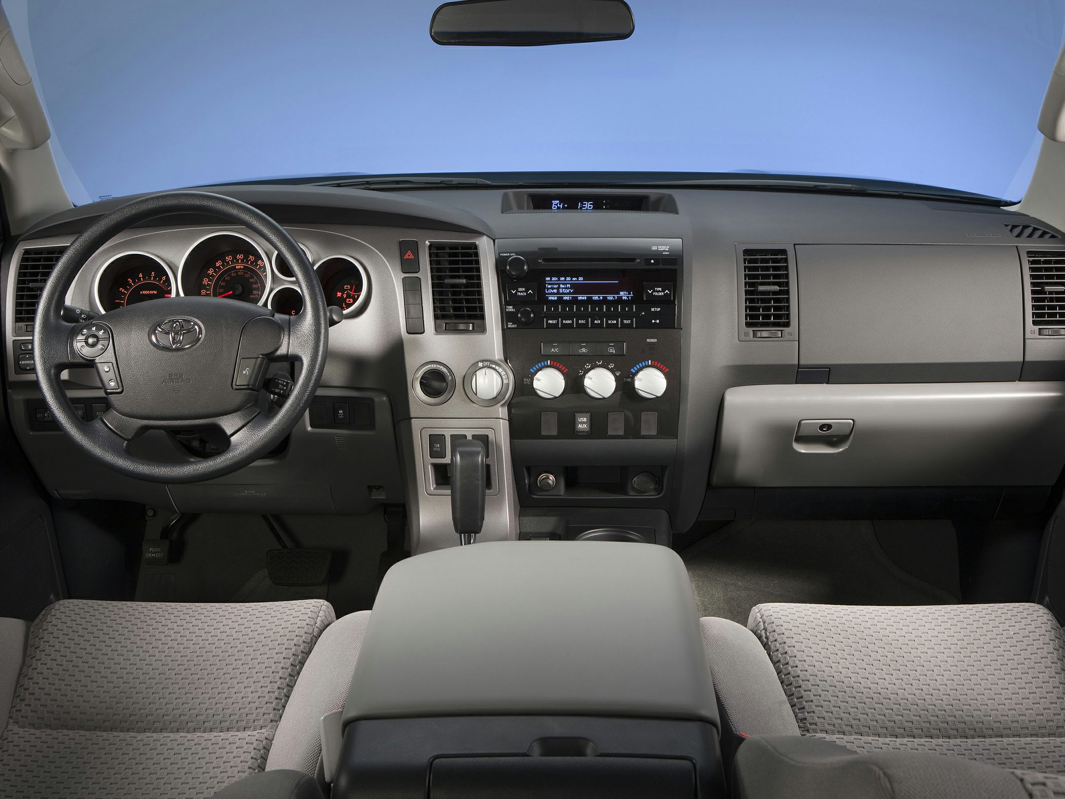 Dashboard and steering wheel with instrument panel and center controls