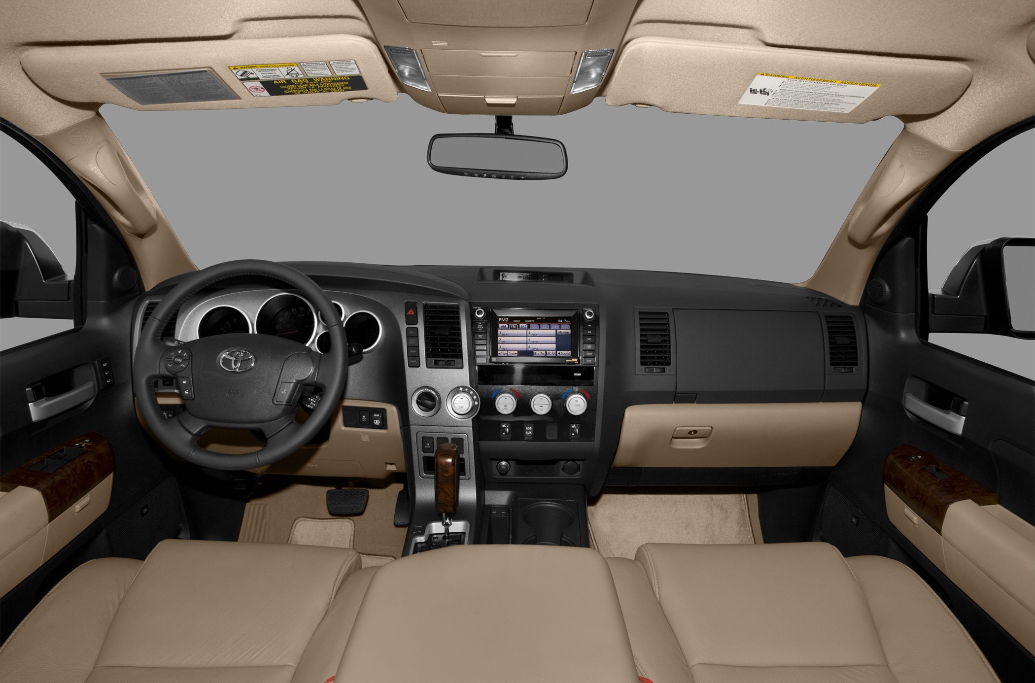 Dashboard, steering wheel, center console with climate and audio controls