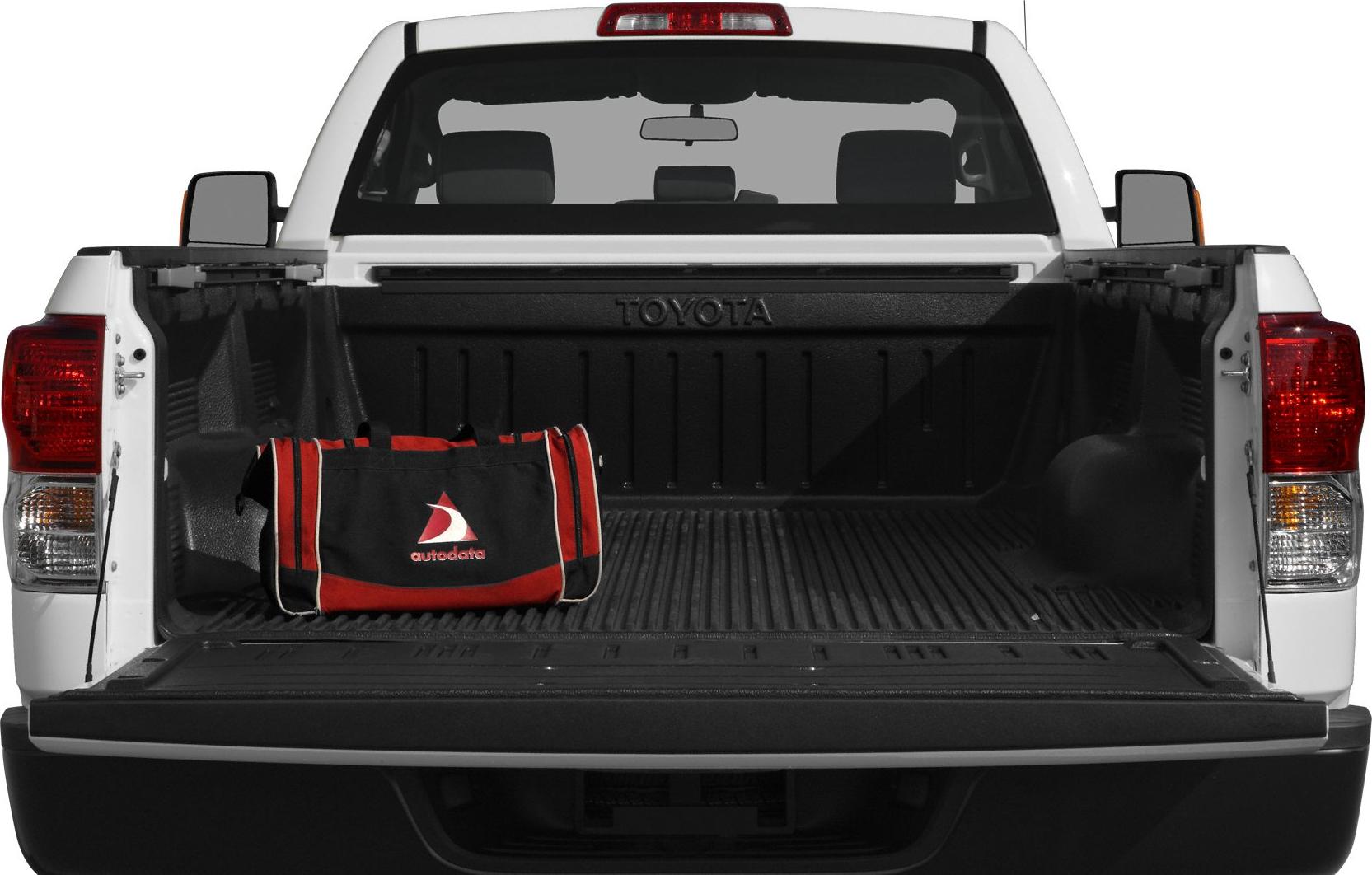 Open truck bed and tailgate with a black and red bag inside