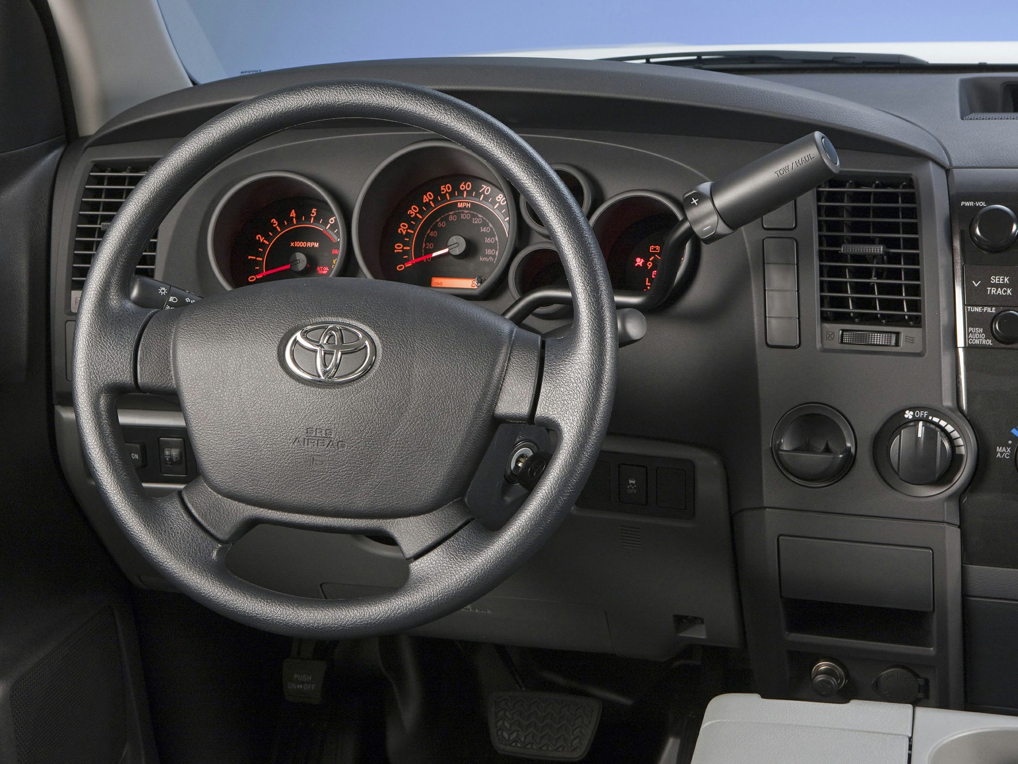 Dashboard and steering wheel with instrument cluster and control panel