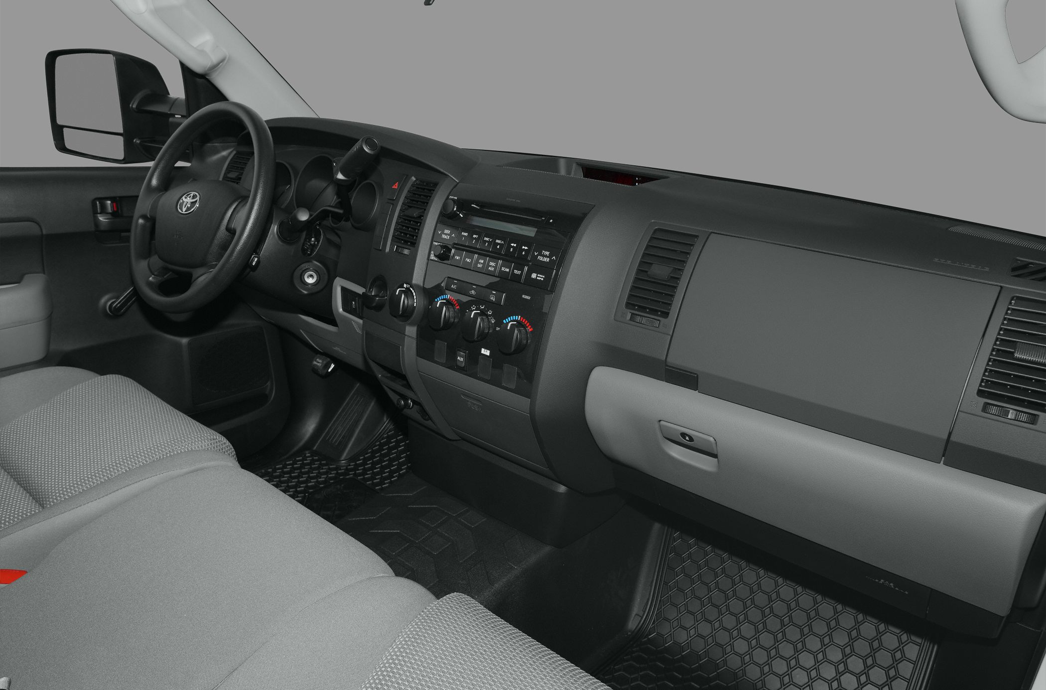 Dashboard and interior layout with steering wheel and control knobs