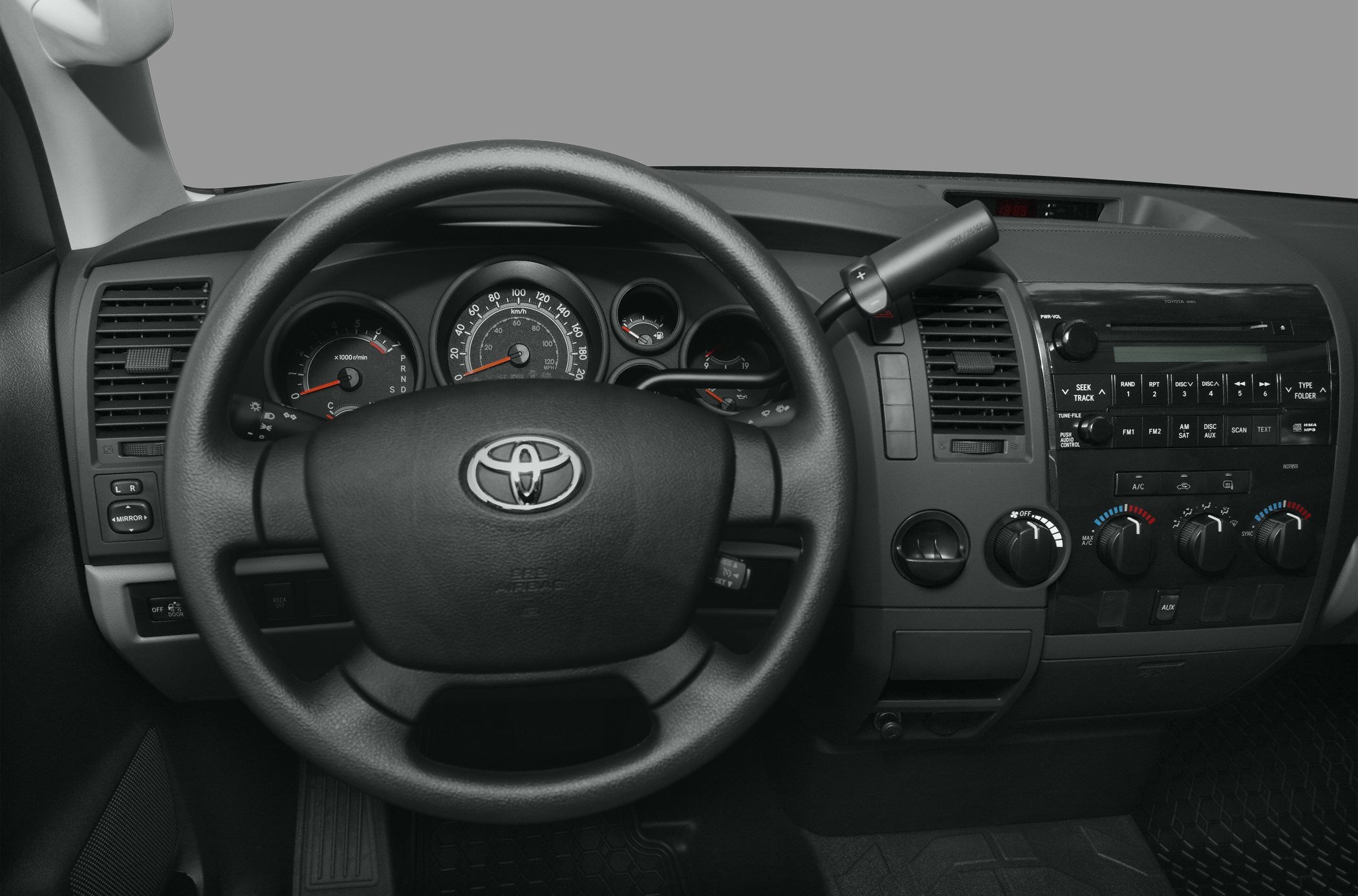Dashboard and steering wheel with controls and gauges