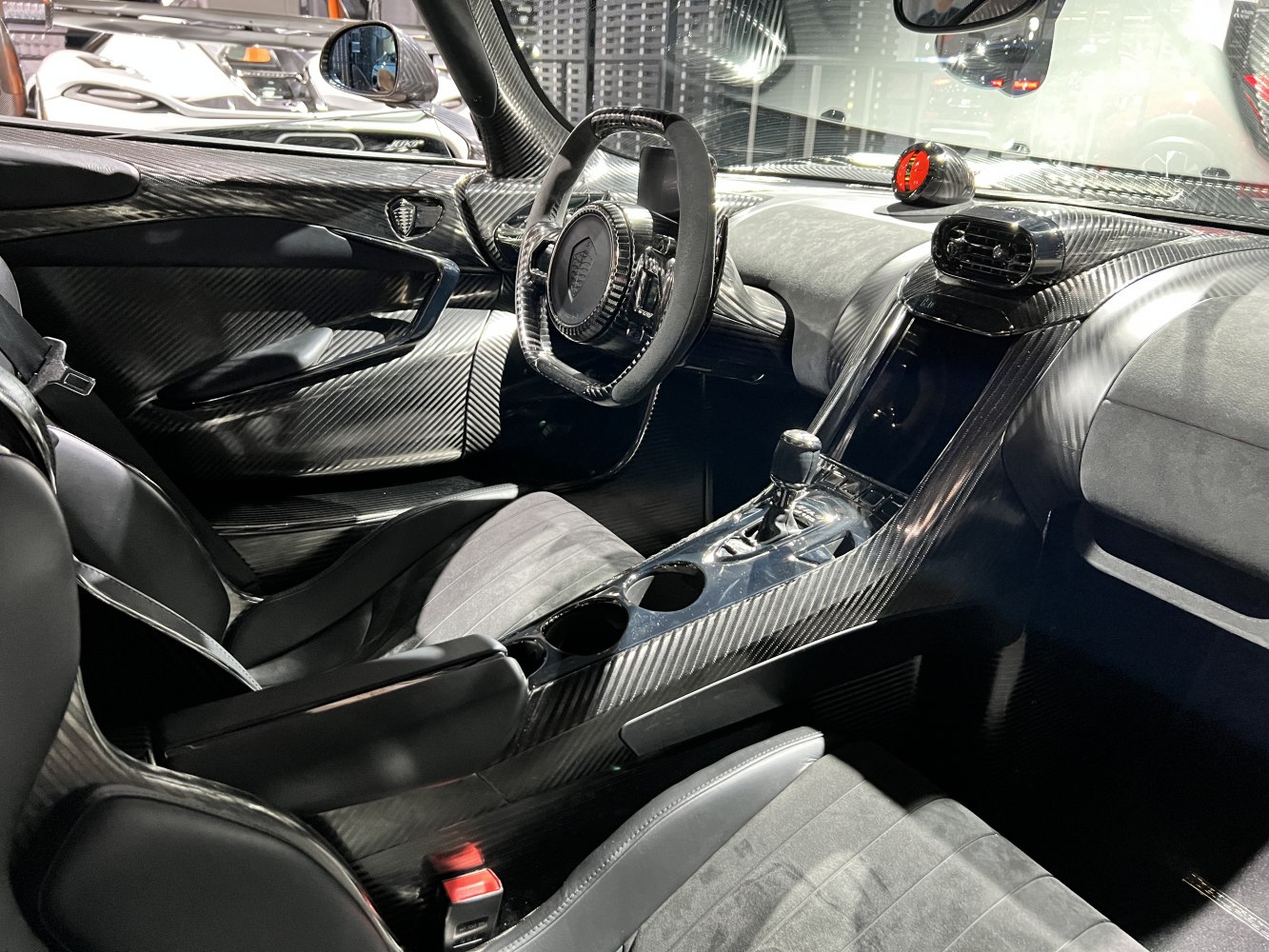 Carbon fiber interior with racing-style steering wheel and advanced center console