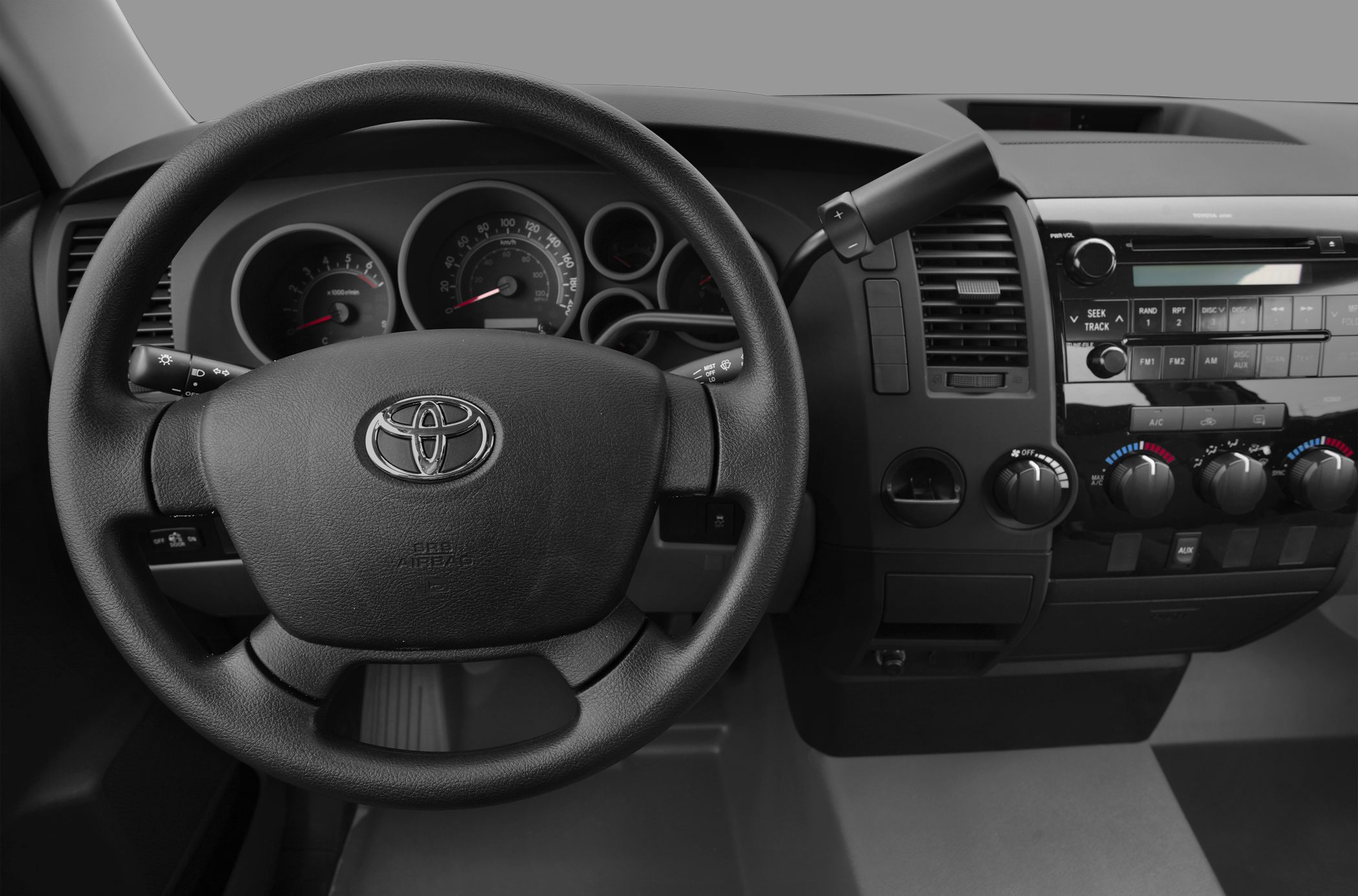 Steering wheel and dashboard with instrument cluster and controls