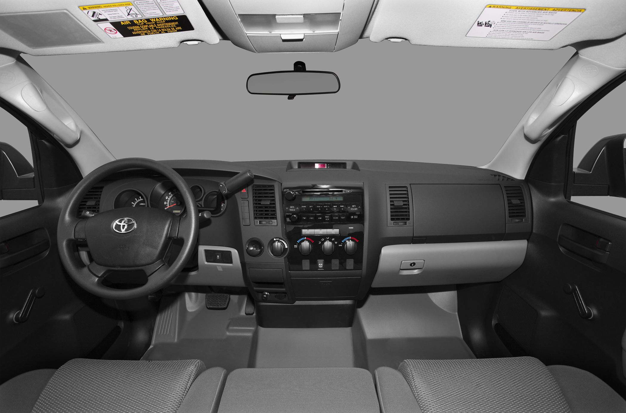Dashboard and steering wheel with manual window controls and audio system