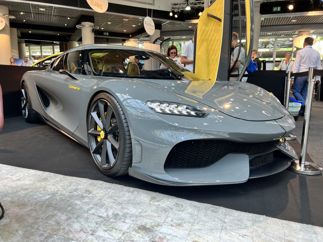 Aerodynamic front design and open butterfly door in luxury sports car
