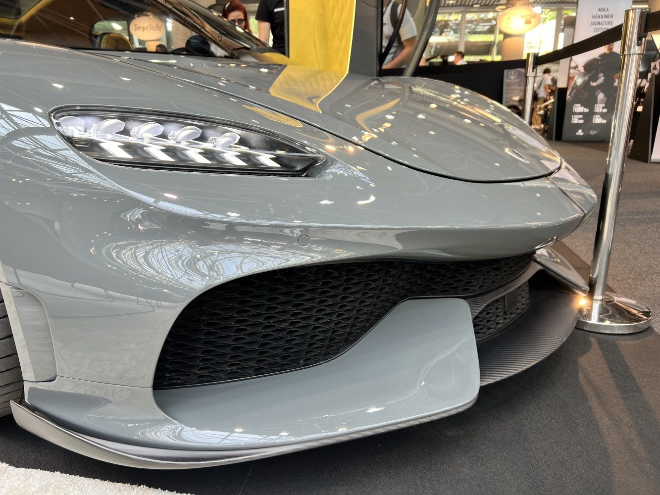 Aerodynamic front bumper with sleek LED headlights and honeycomb grille