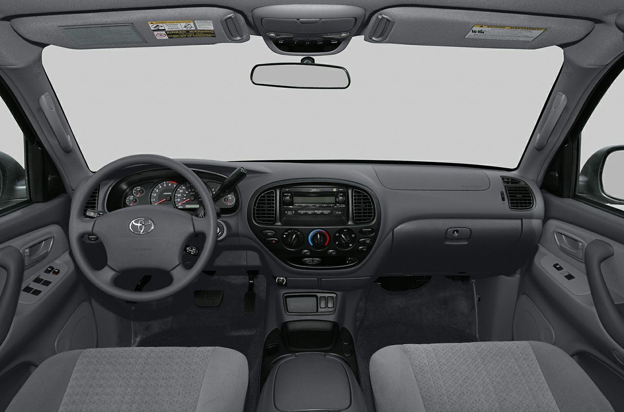 Dashboard and interior cabin view with steering wheel and control panel