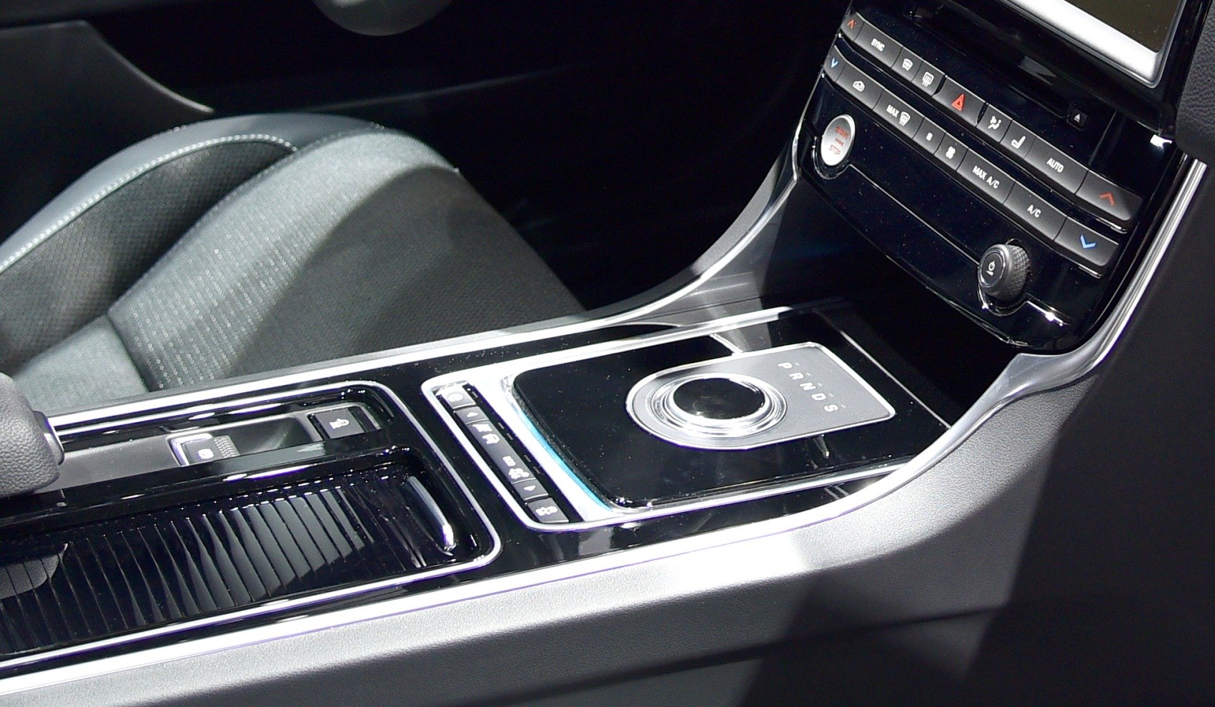 Center console with rotary gear selector and climate controls
