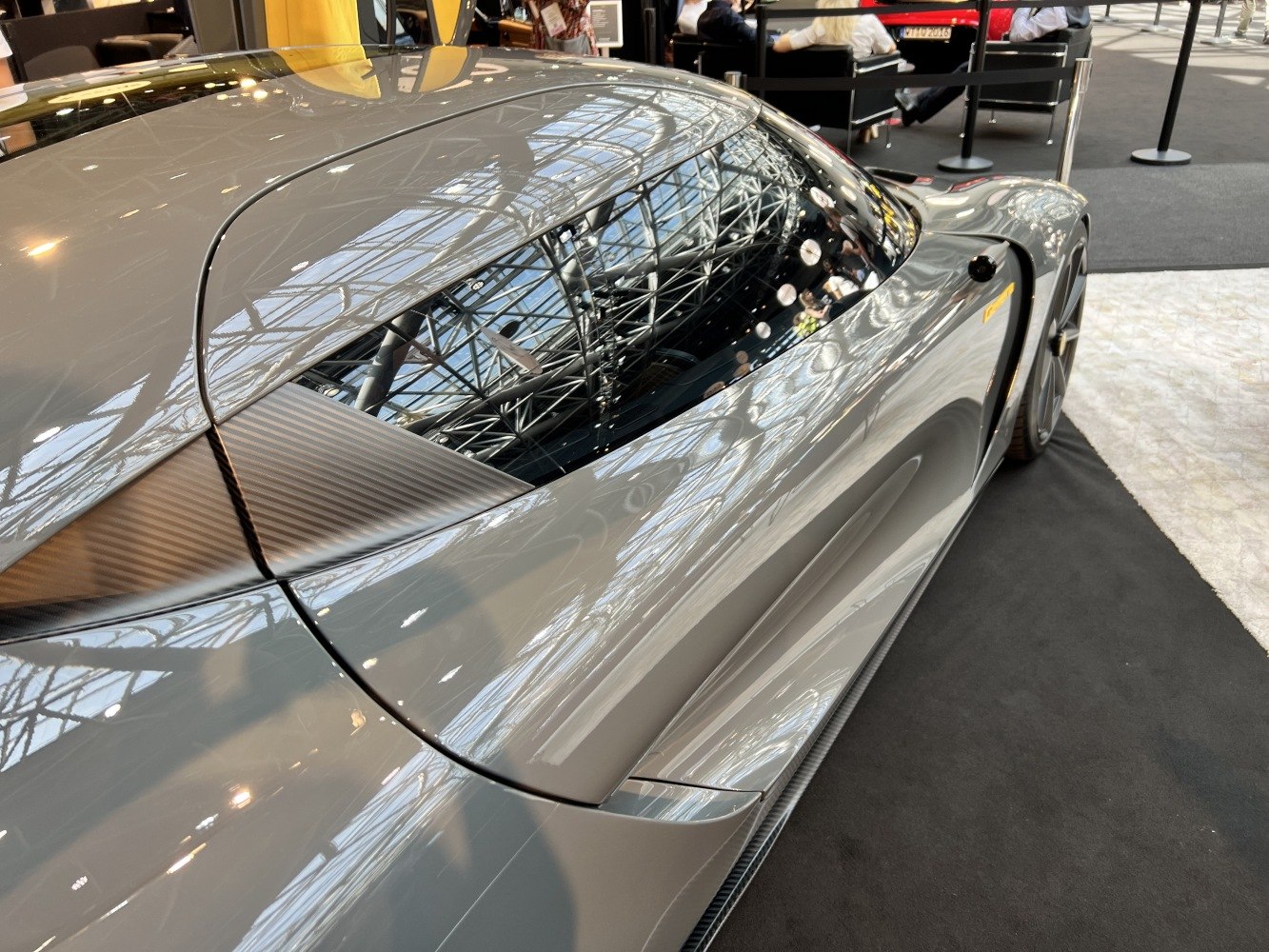 Sleek rear side with carbon fiber accents and tinted window