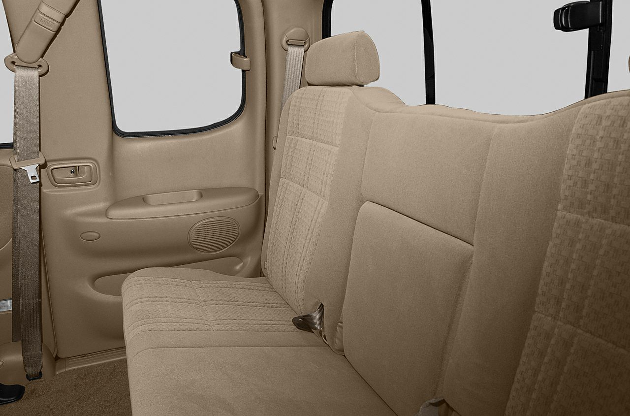 Rear seat upholstery and door panel with seatbelt in beige fabric